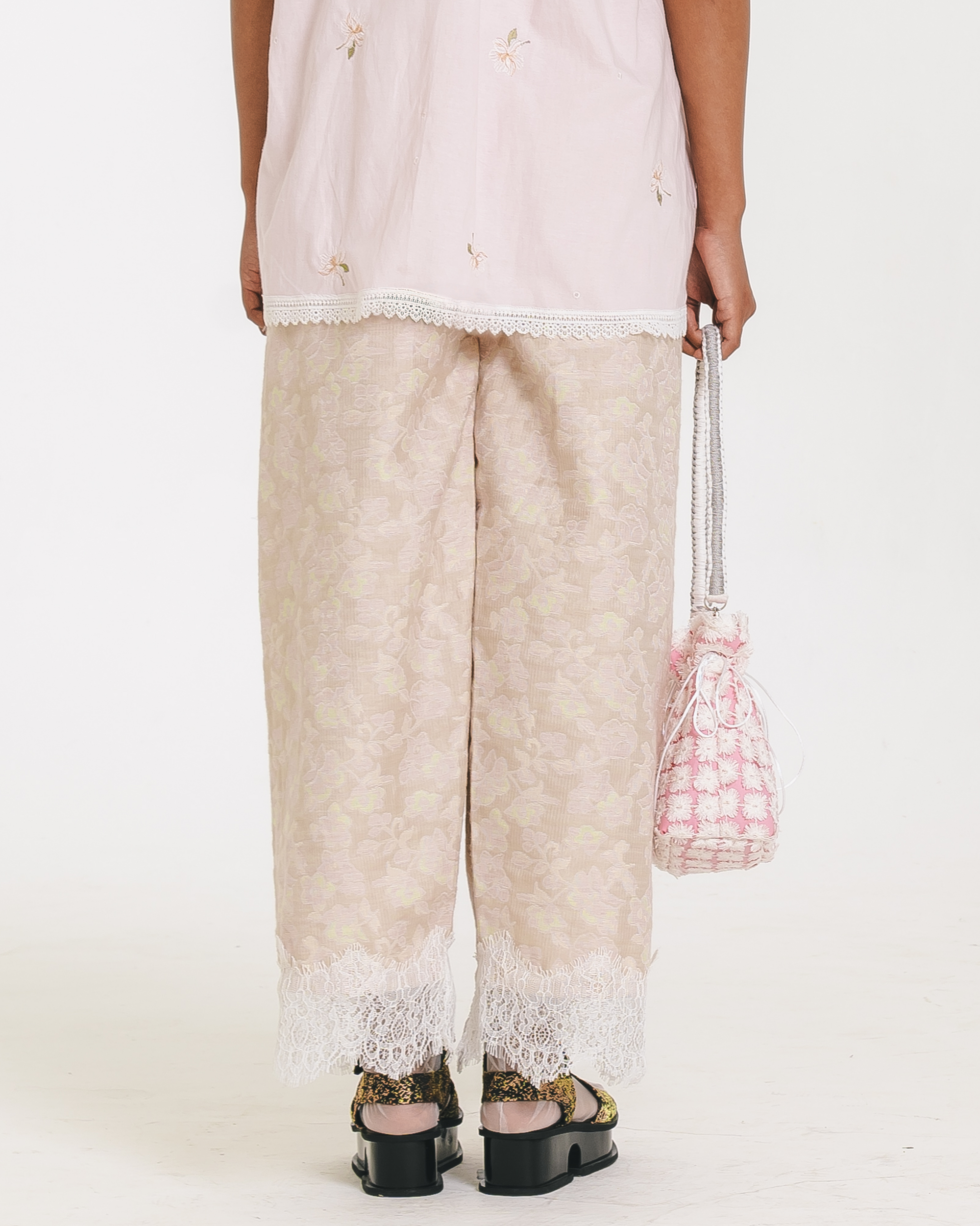 Image of Athena Embroidery Pants, a relaxed pants with elastic waist, made from cotton with a lace hem.