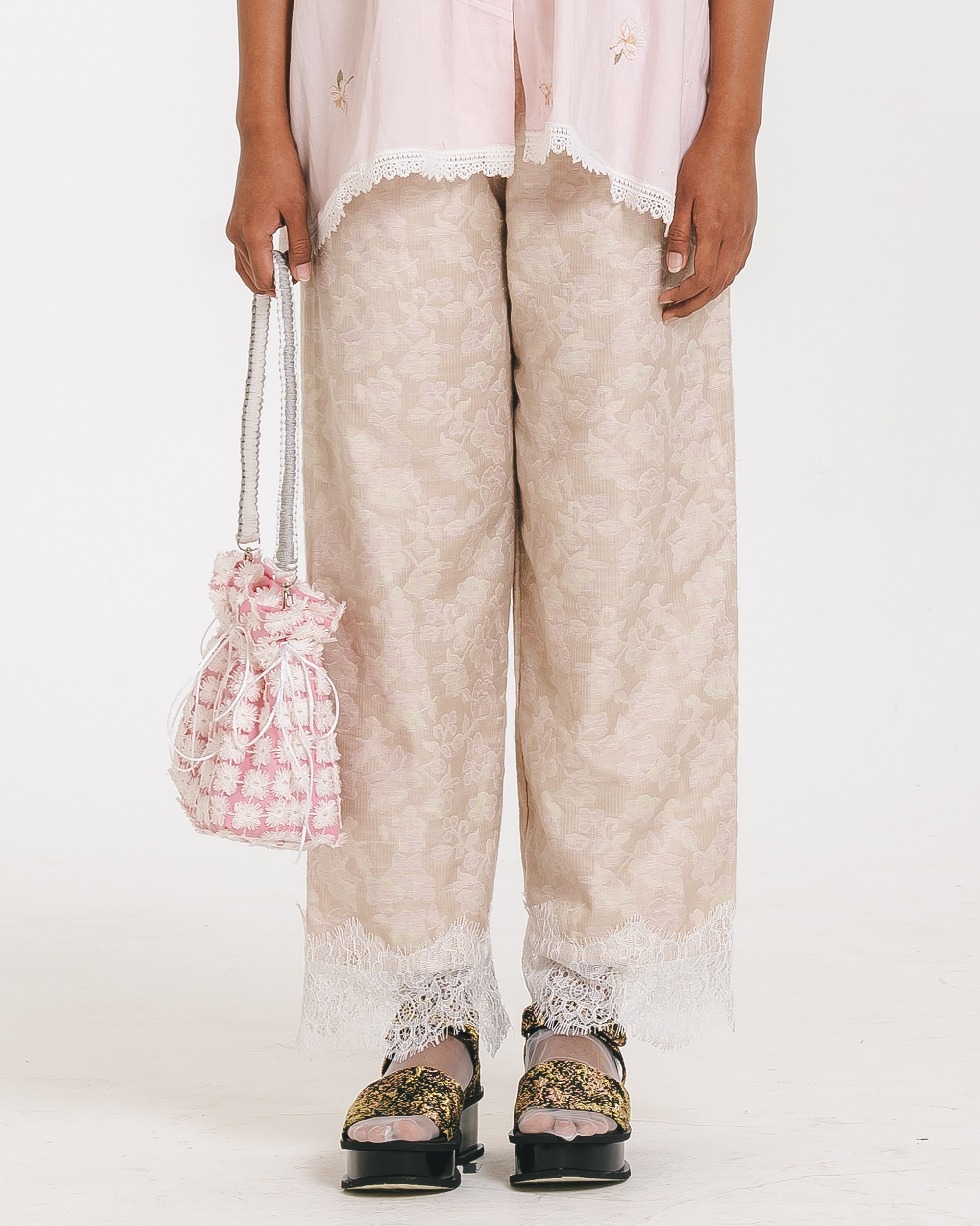 Image of Athena Embroidery Pants, a relaxed pants with elastic waist, made from cotton with a lace hem.