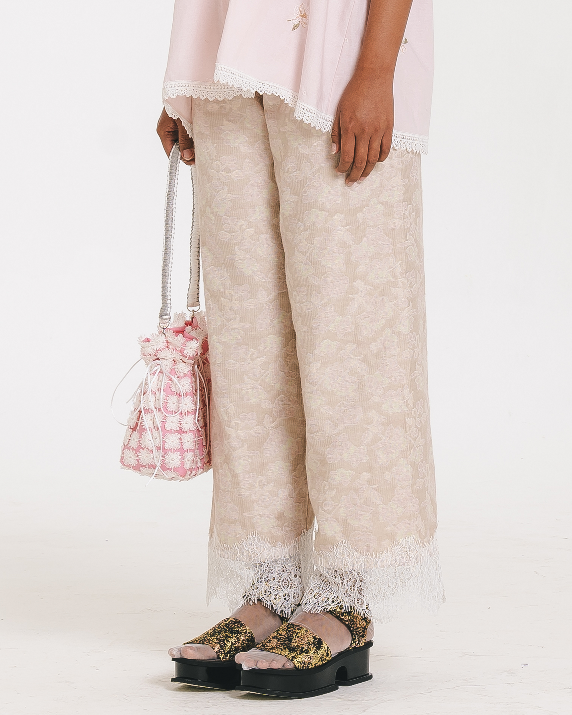 Image of Athena Embroidery Pants, a relaxed pants with elastic waist, made from cotton with a lace hem.
