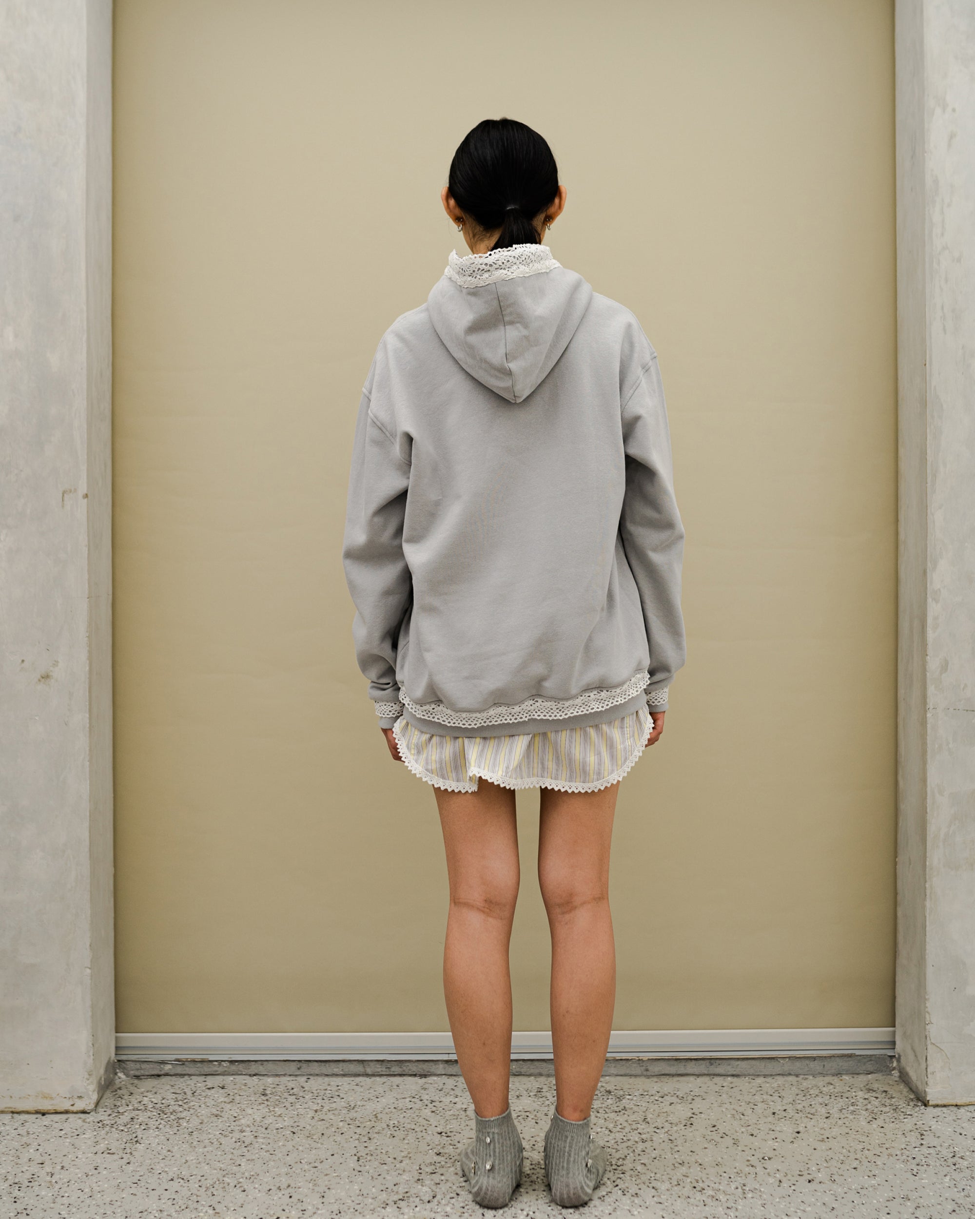 Image of Dune Lace Hoodie Grey, a hoodie jacket with lace detail on along the zipper.