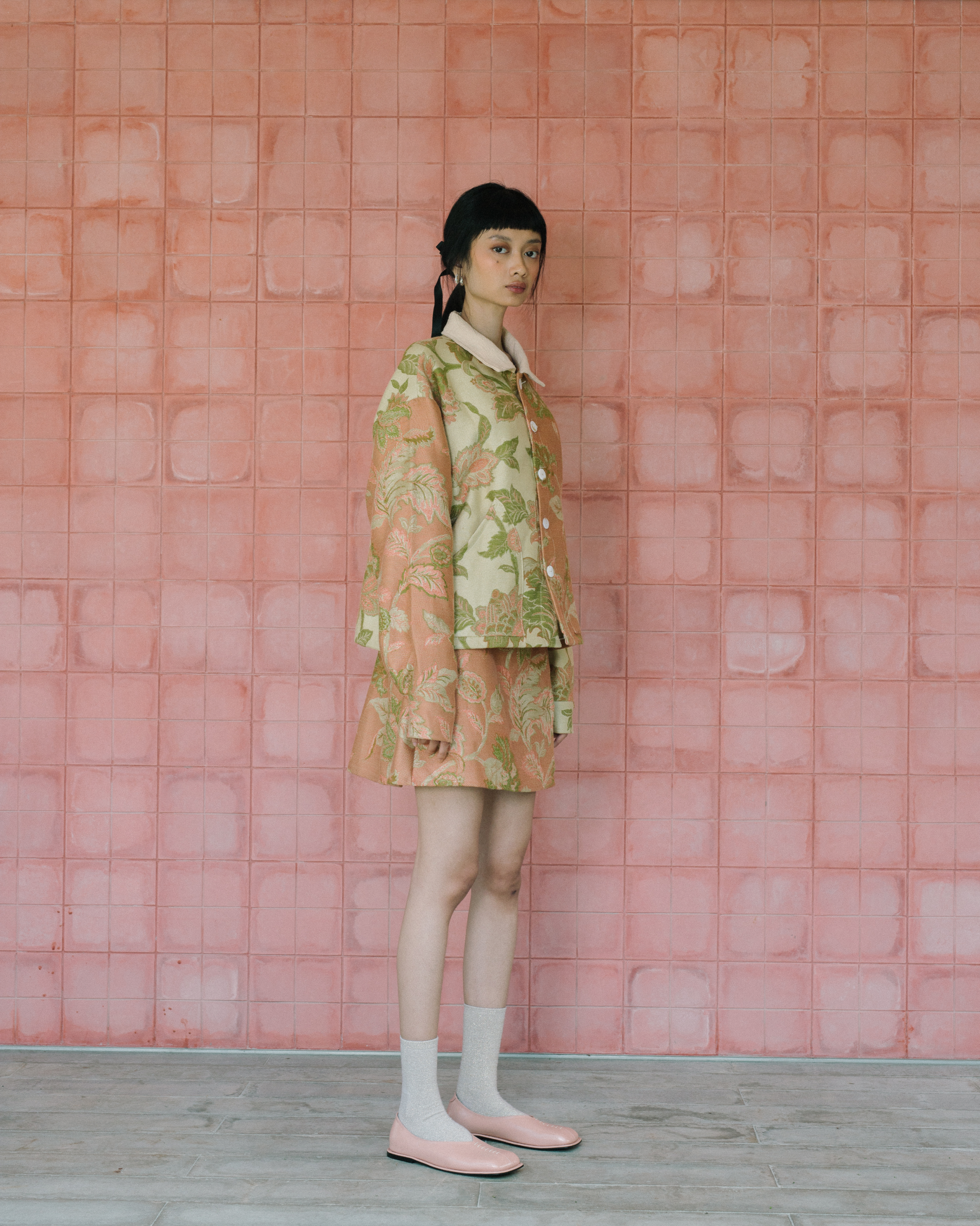 Image of Gretl Flower Jacket, a relaxed fit jacket made from jacquard fabric, adorned with unique white buttons.