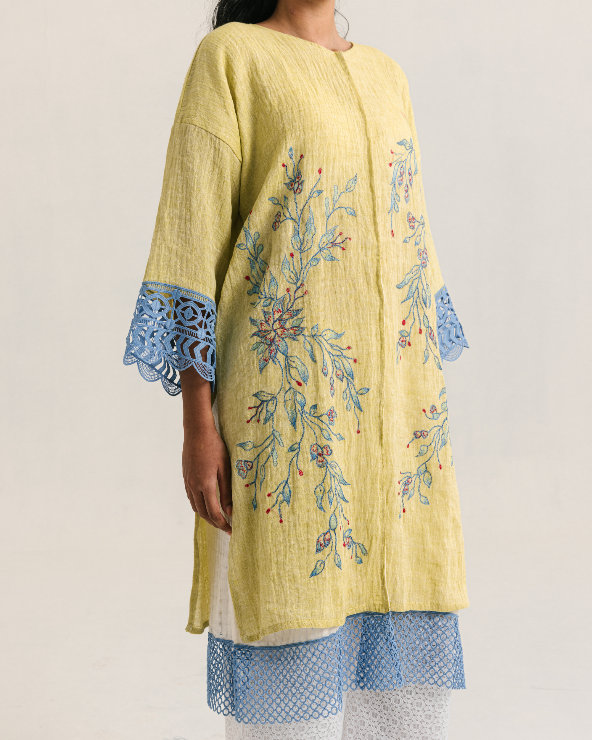 Image of Lara Embroidery Kaftan Lime, a kaftan made from breathable linen, adorned with charming embroidery and lace on the hem.