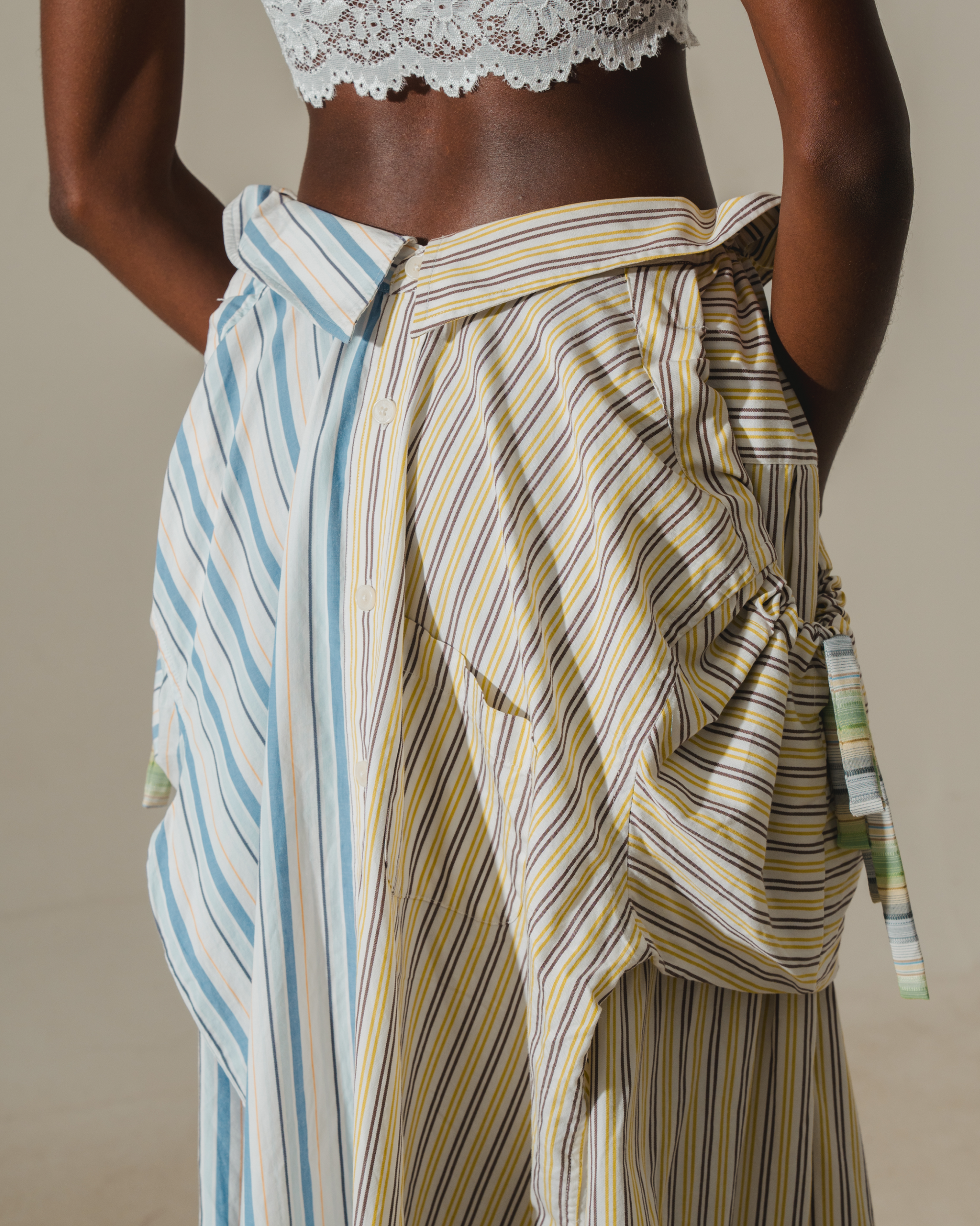 Image of RE-WORK SKIRT, a midi skirt made from two shirts combined together.