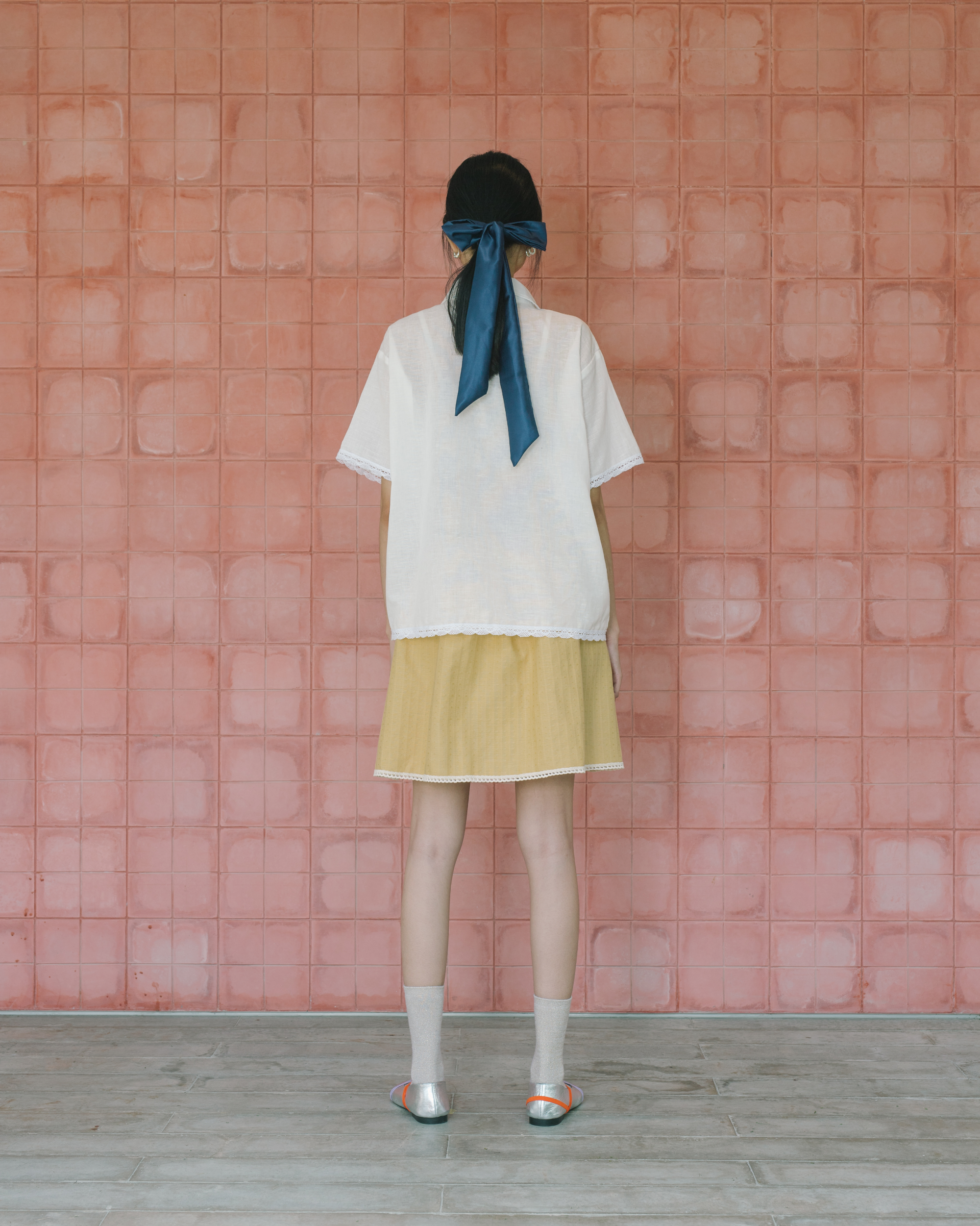 Image of Sophia Cross Sitches Shirt, a relaxed linen shirt adorned with intricate cross-stitches detail adds unique, artisanal touch of the design.