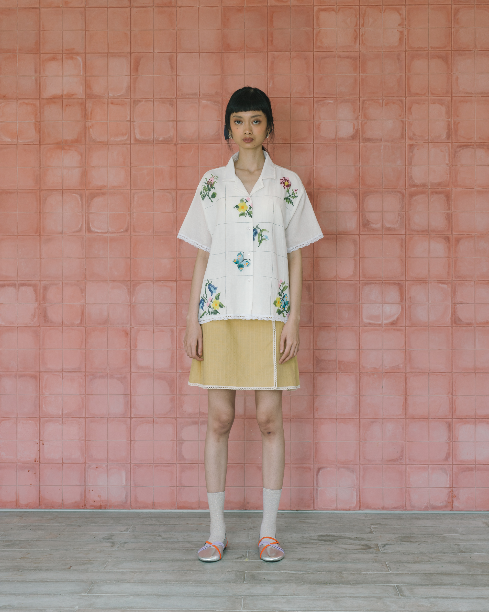 Image of Sophia Cross Sitches Shirt, a relaxed linen shirt adorned with intricate cross-stitches detail adds unique, artisanal touch of the design.