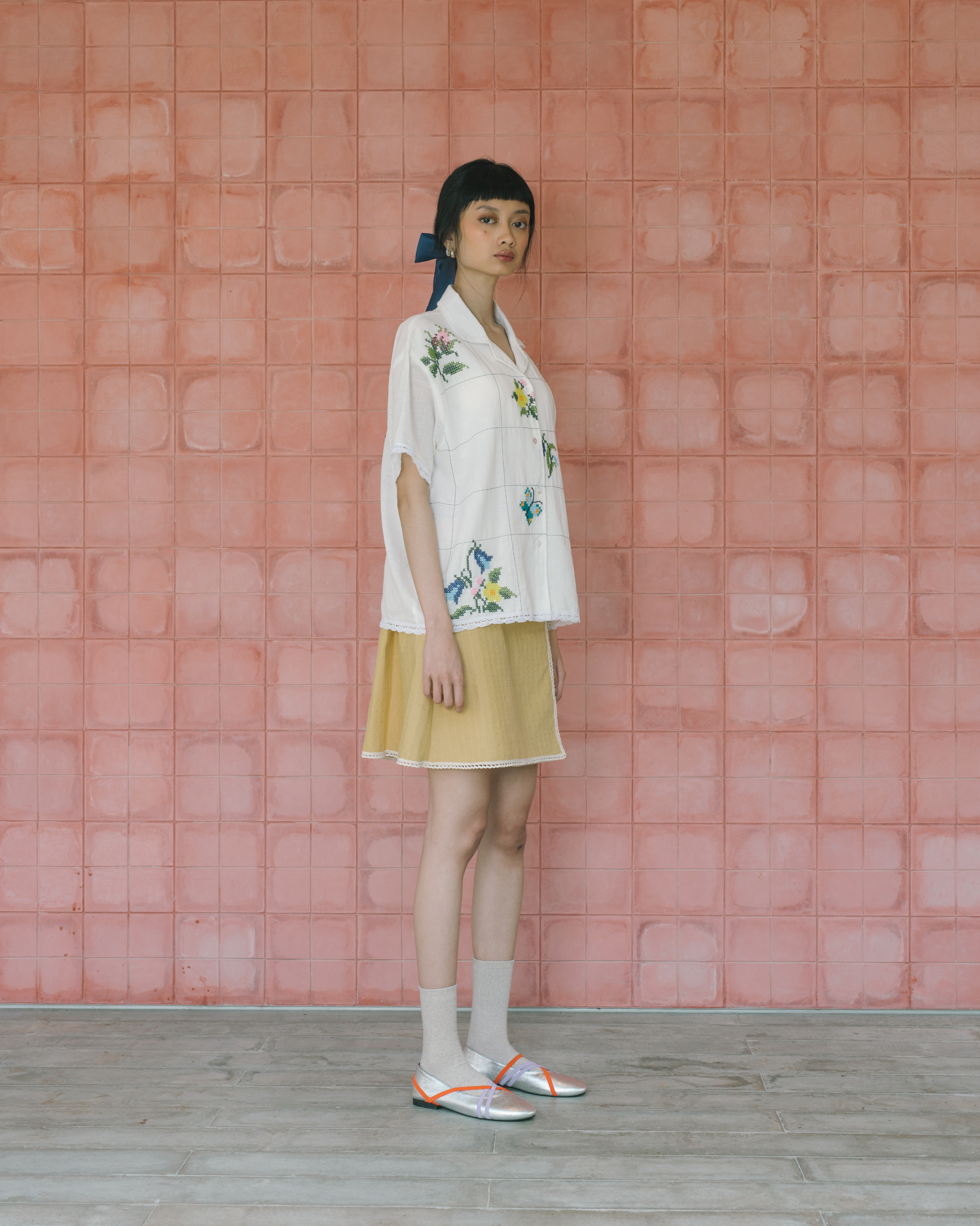 Image of Sophia Cross Sitches Shirt, a relaxed linen shirt adorned with intricate cross-stitches detail adds unique, artisanal touch of the design.