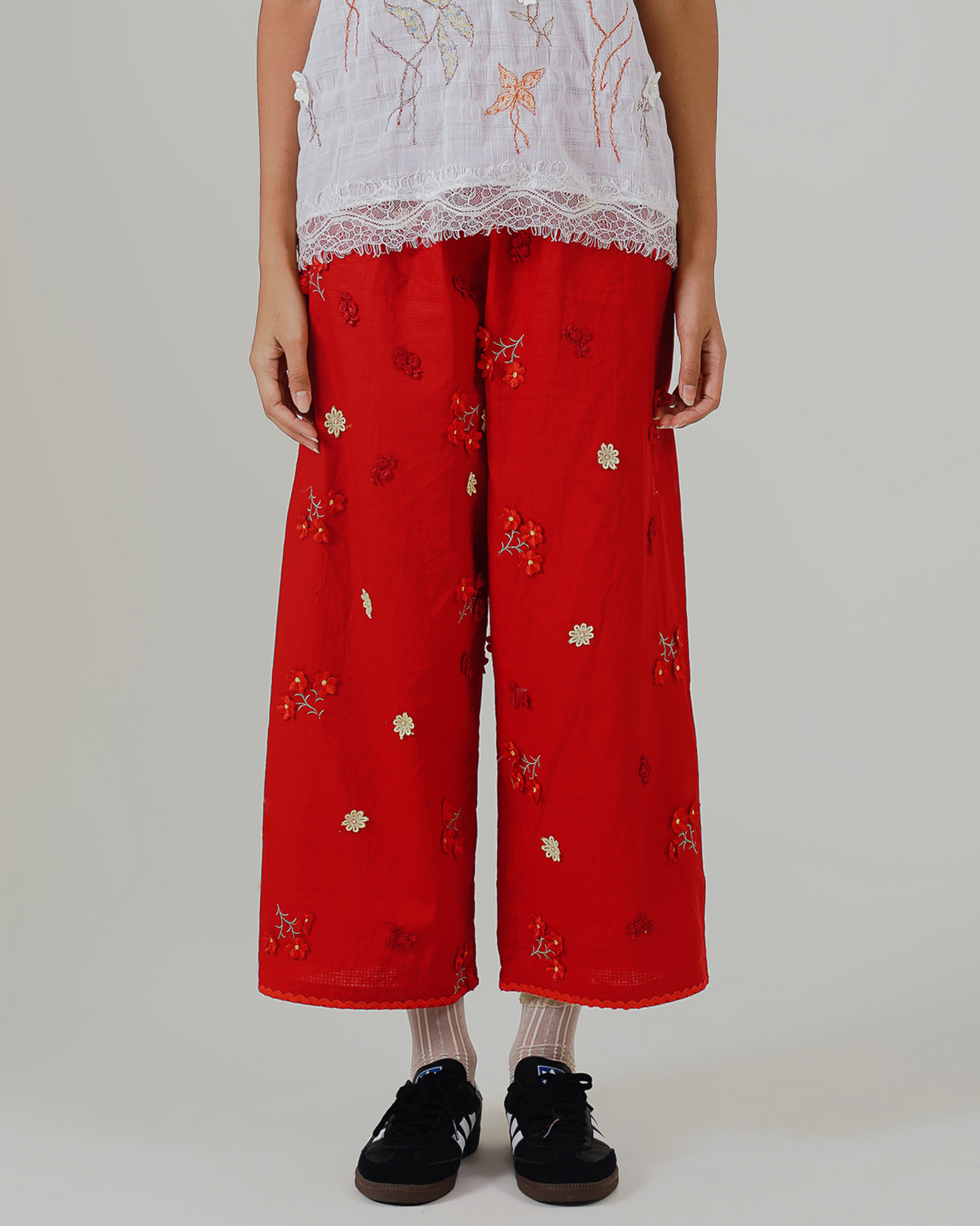 Image of Soraya Pants, a linen wide-leg relaxed pants adorned with floral embroidery.