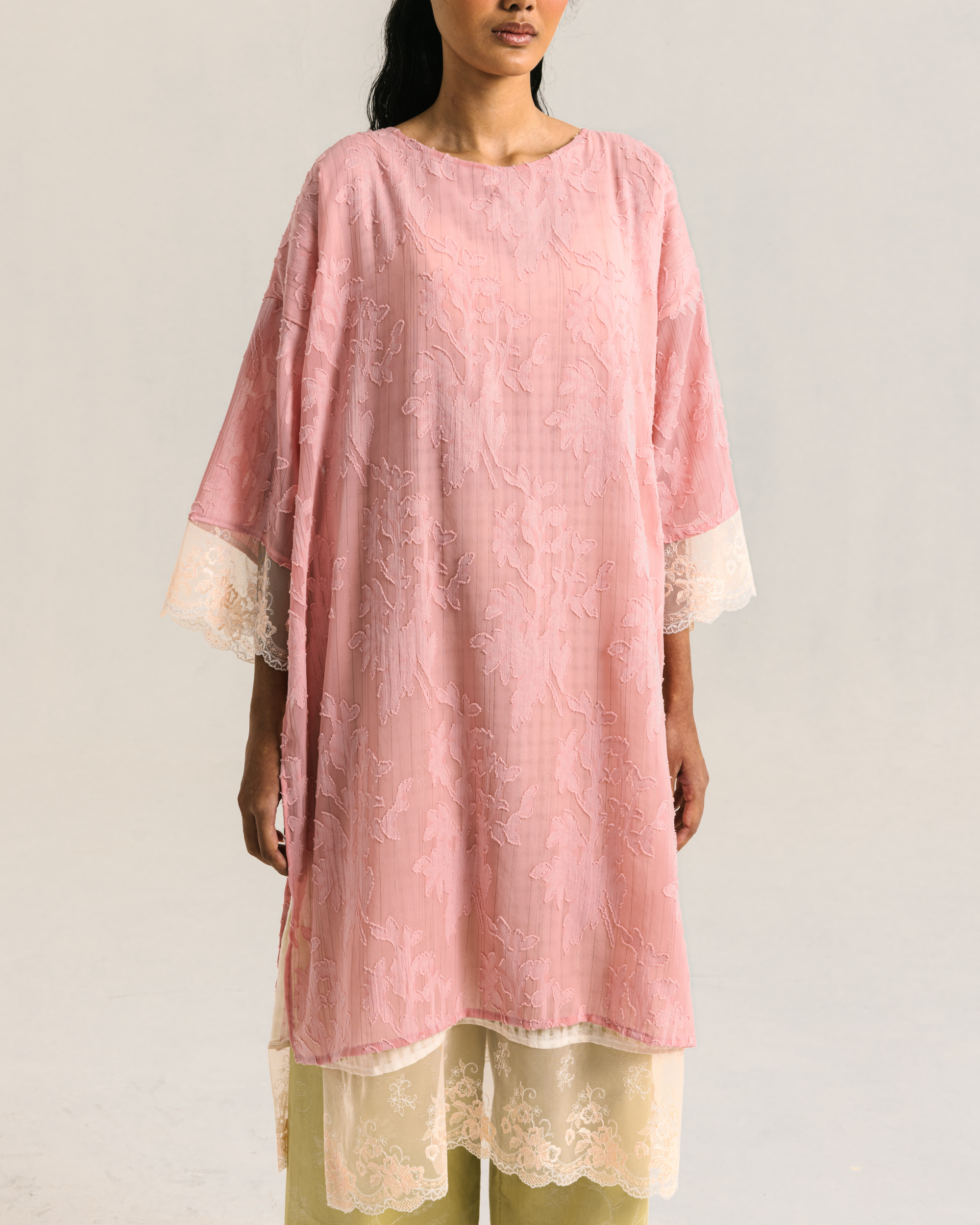 Image of Viola Kaftan Pink, a kaftan made from cotton-poly with a delicate floral pattern, adorned with lace on the hem.