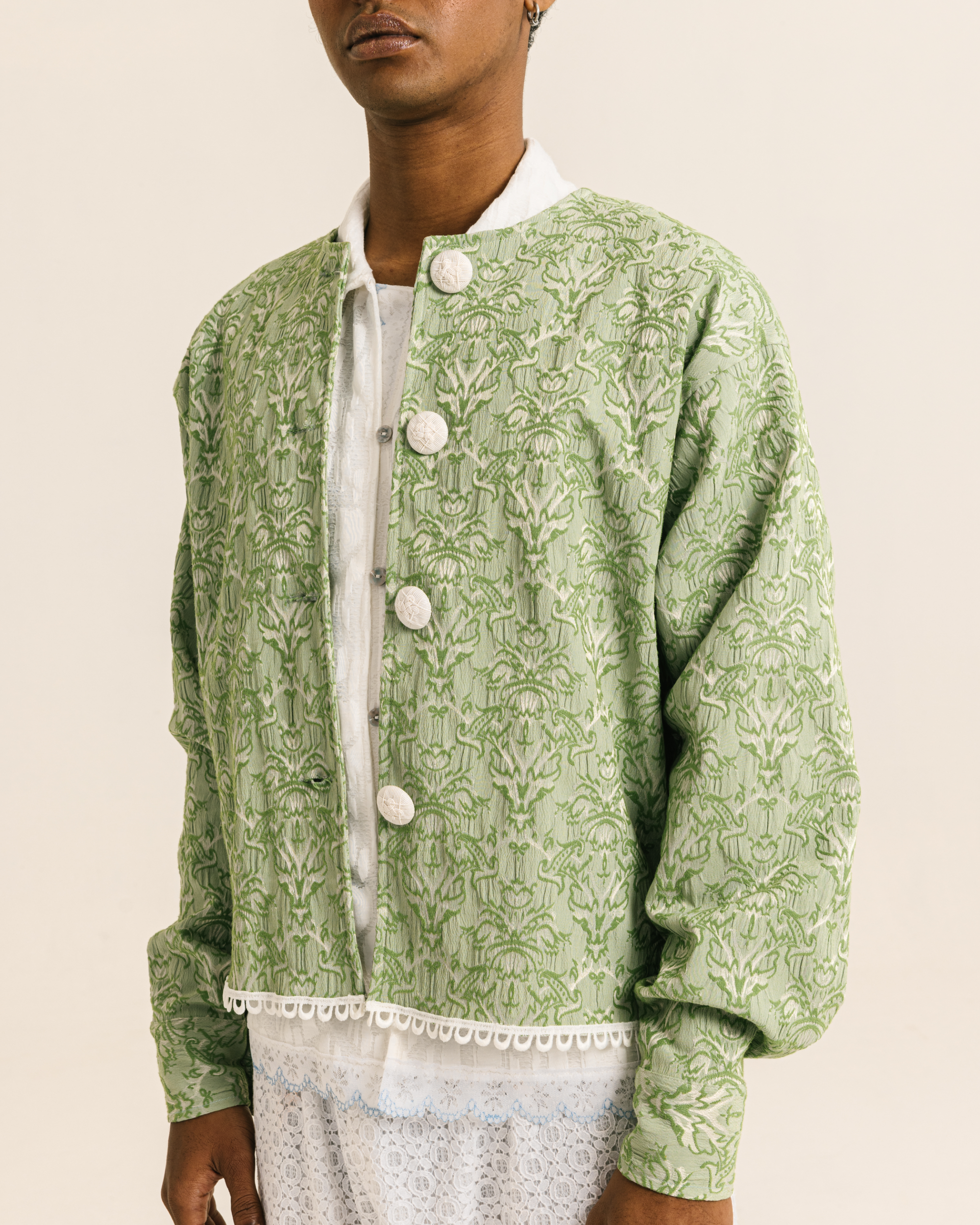 Image of Agatha Jacket Green, a relaxed fit jacket with a charming neckline, made from vintage jacquard fabric. 