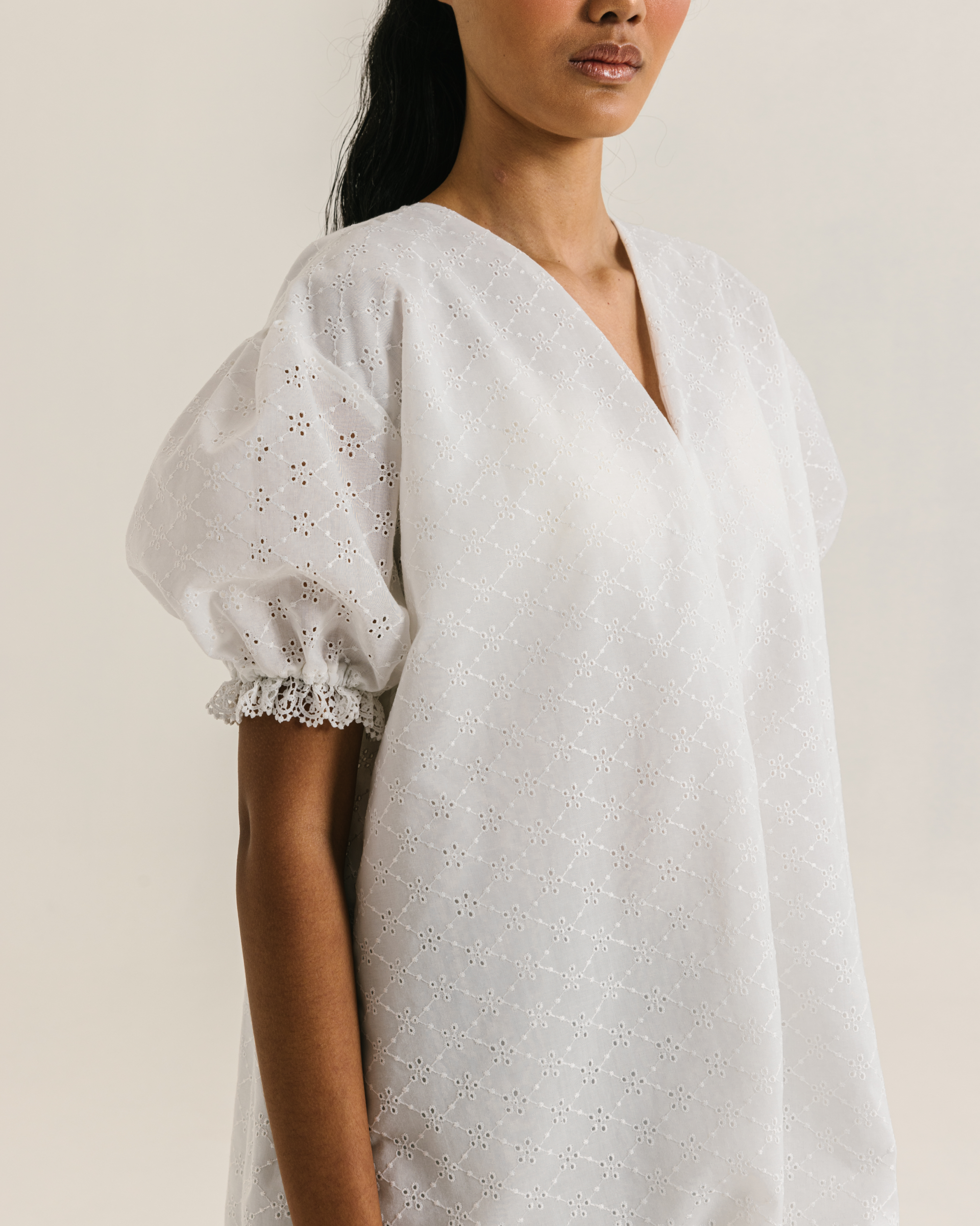 Image of Alaia Blouse White, a loose blouse with a subtle balloon sleeves and charming v-neckline.