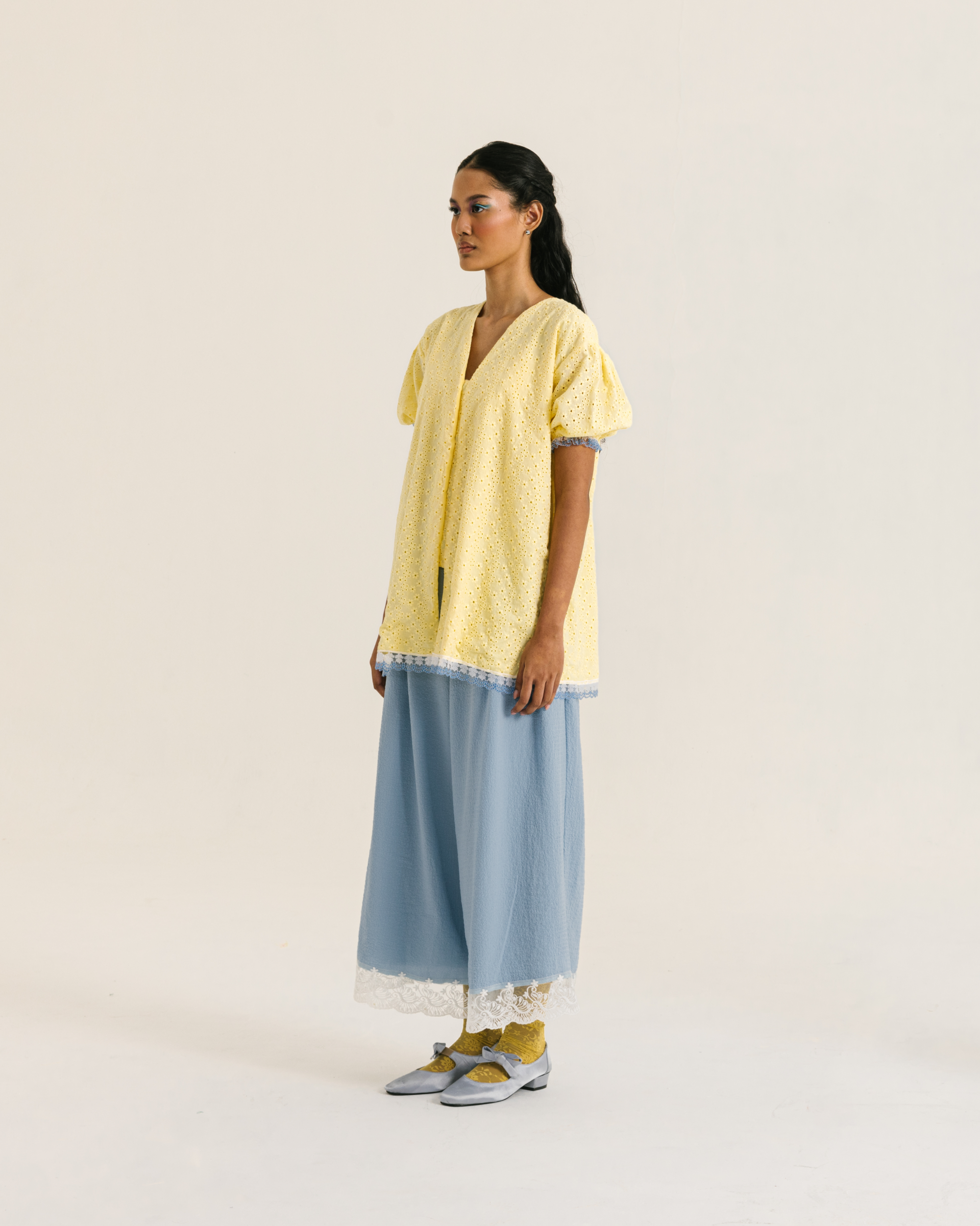 Image of Alaia Blouse Yellow, a loose blouse with a subtle balloon sleeves and charming v-neckline.