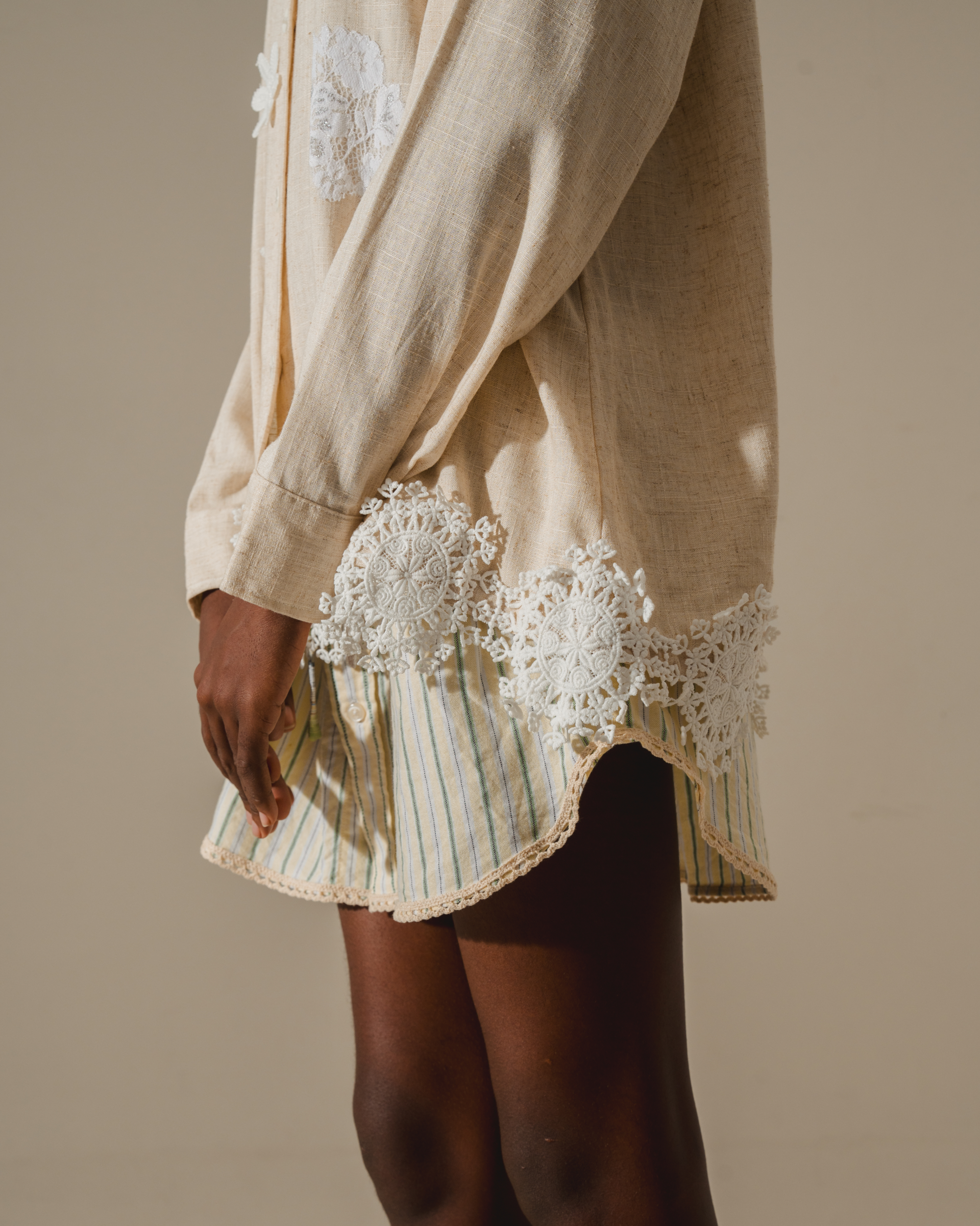 Image of Alette Embroidery Blouse, a longsleeve blouse made from deadstock linen, adorned with delicate lace detailing on the hem and neckline.