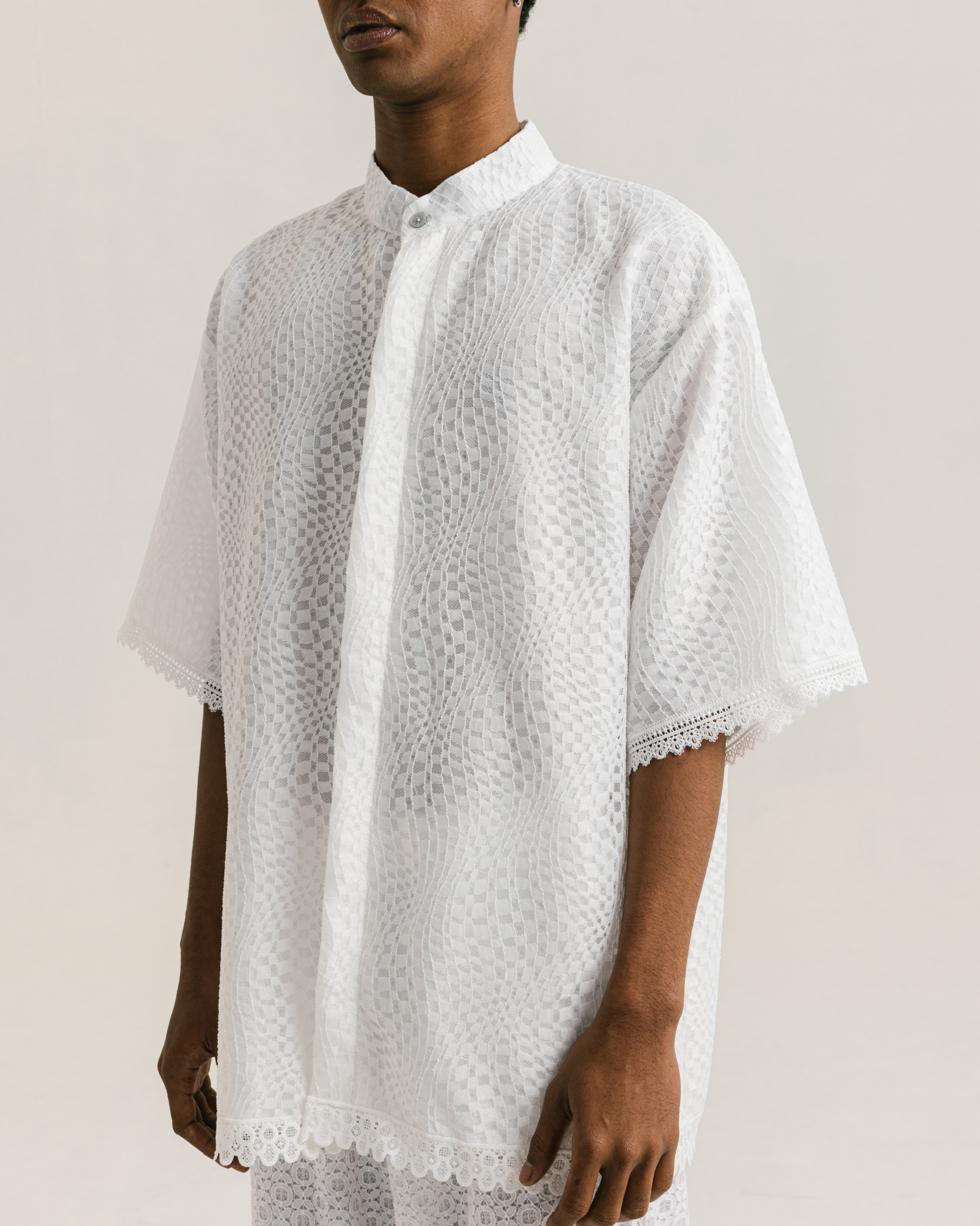 Image of Archie Koko Shirt White, an oversized koko shirt made from brocade with a cotton lining underneath.