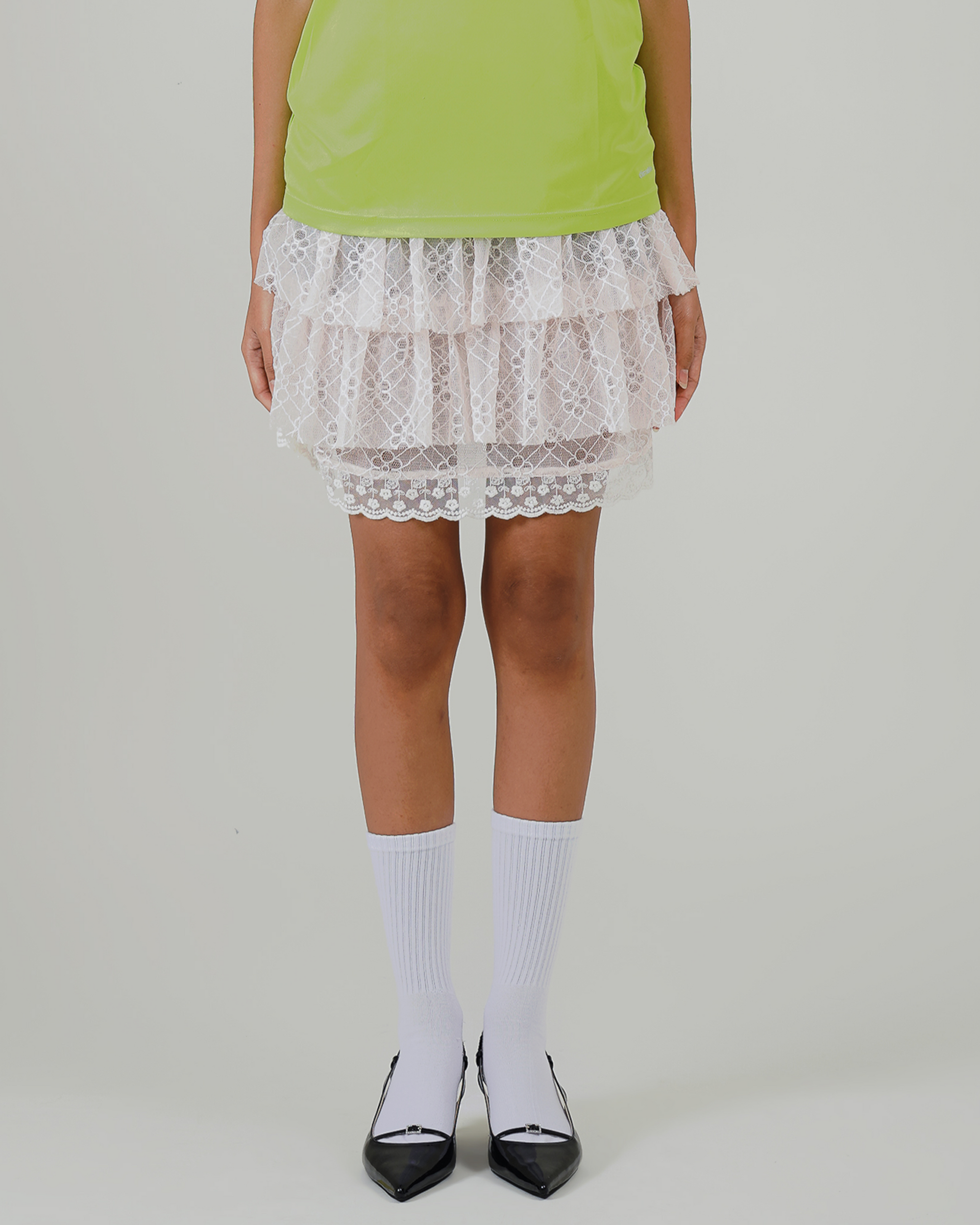 Image of Aruna Mini Ruffle Skirt Creme, a ruffle mini skirt made from lace and lined for coverage.