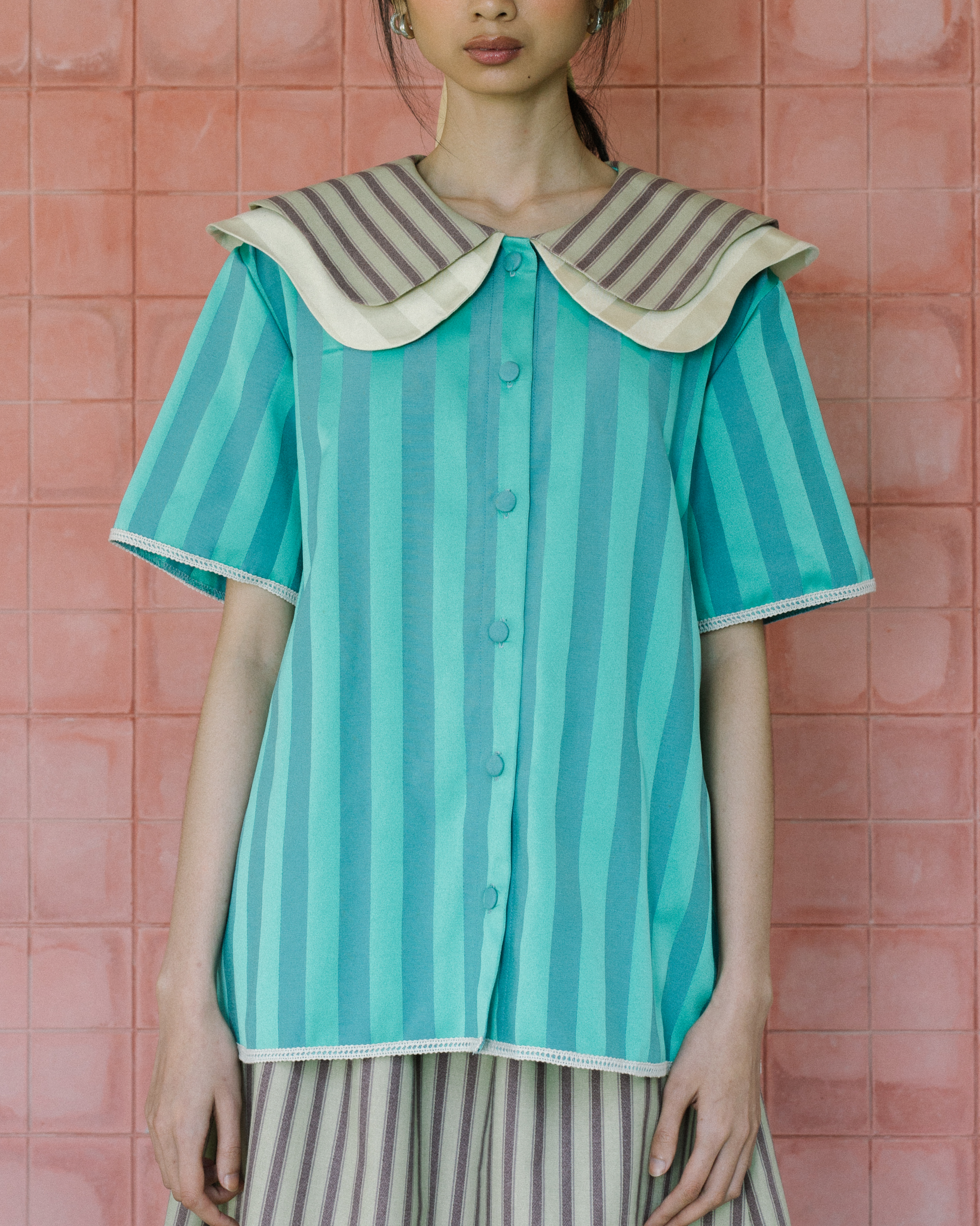 Image of Augusta Peter Pan Shirt, an eye-cathing piece with a unique combination of a peterpan collar, making it playful yet stylish. 