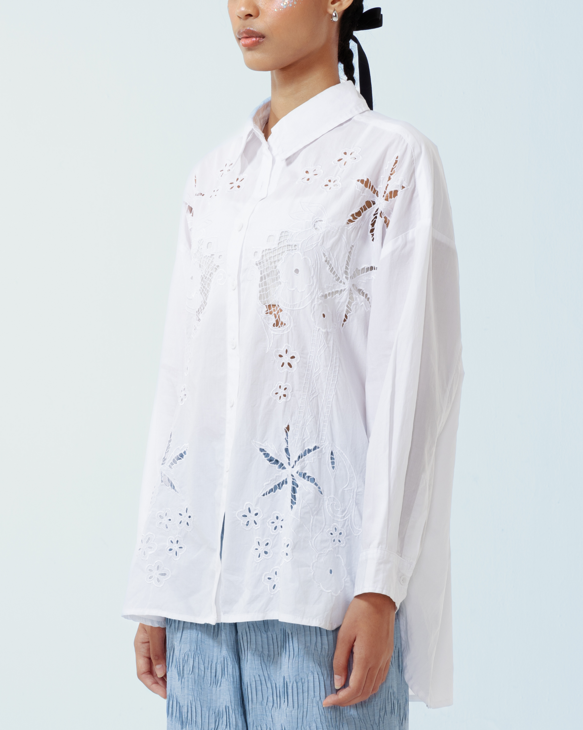 Image of Azul Longsleeve Shirt, a longsleeve shirt made from cotton poplin, adorned with hand-embroidery motifs inspired by kerawang embroidery.