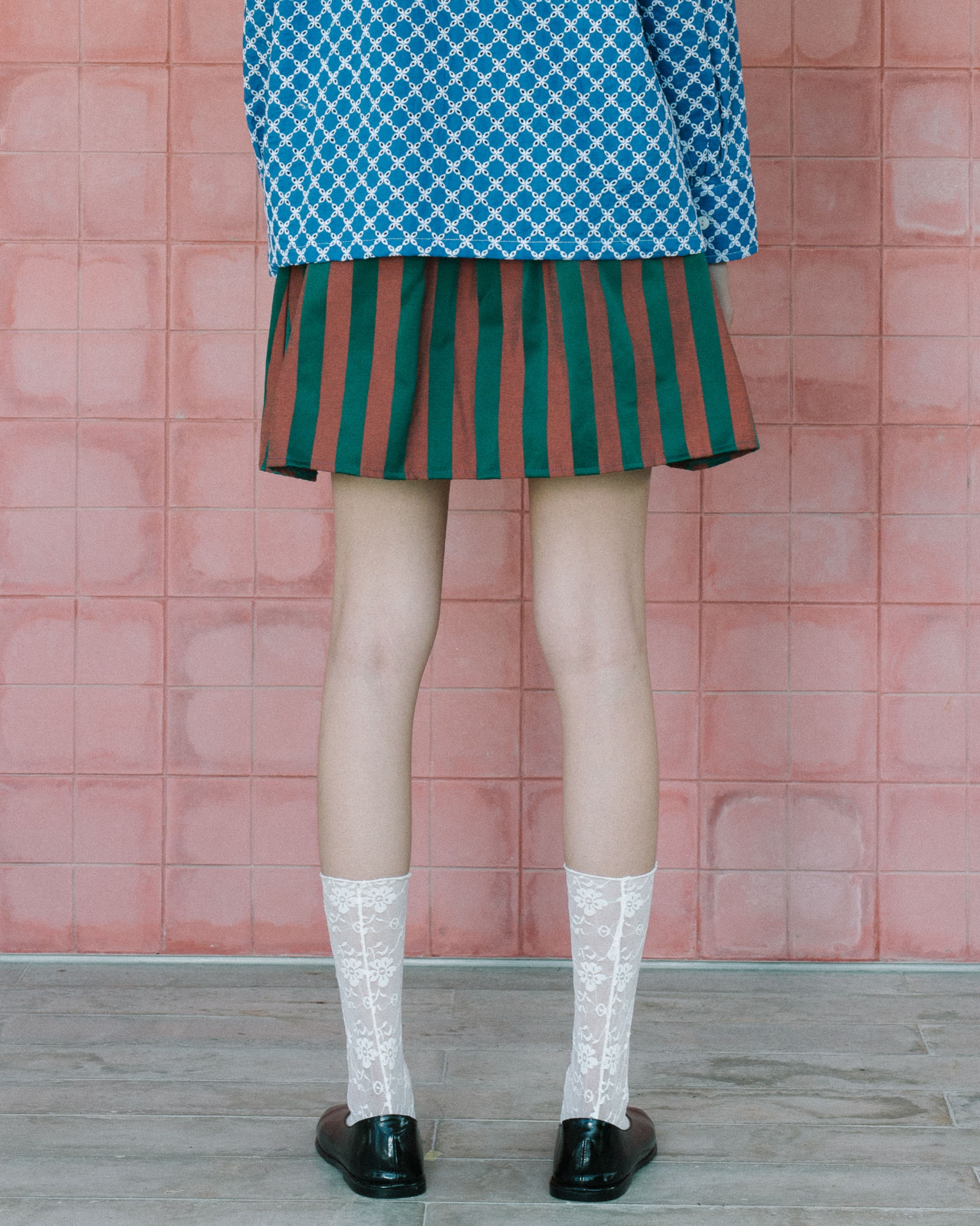 Image of Berthe Mini Wrap Skirt, a playful mini skirt with a flattering wrap design made from jacquard cotton.