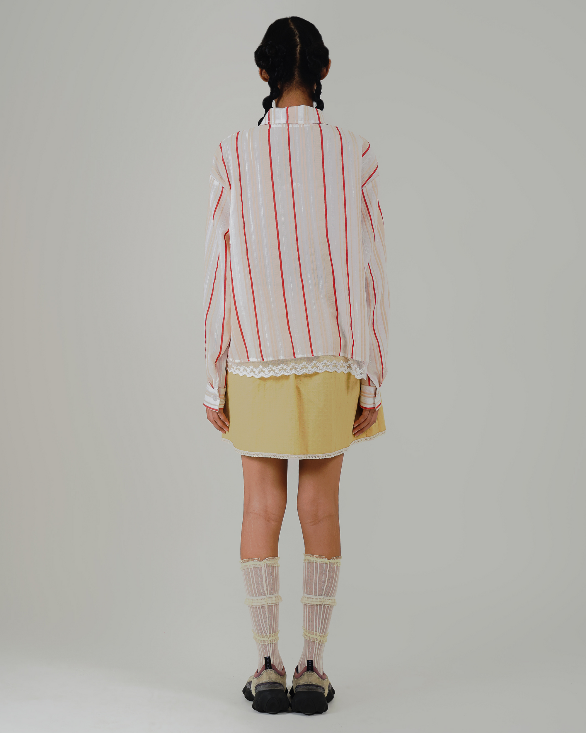 Image of Cempaka Stripes Jacket, a linen jacket with pockets and delicate lace details at the hem.