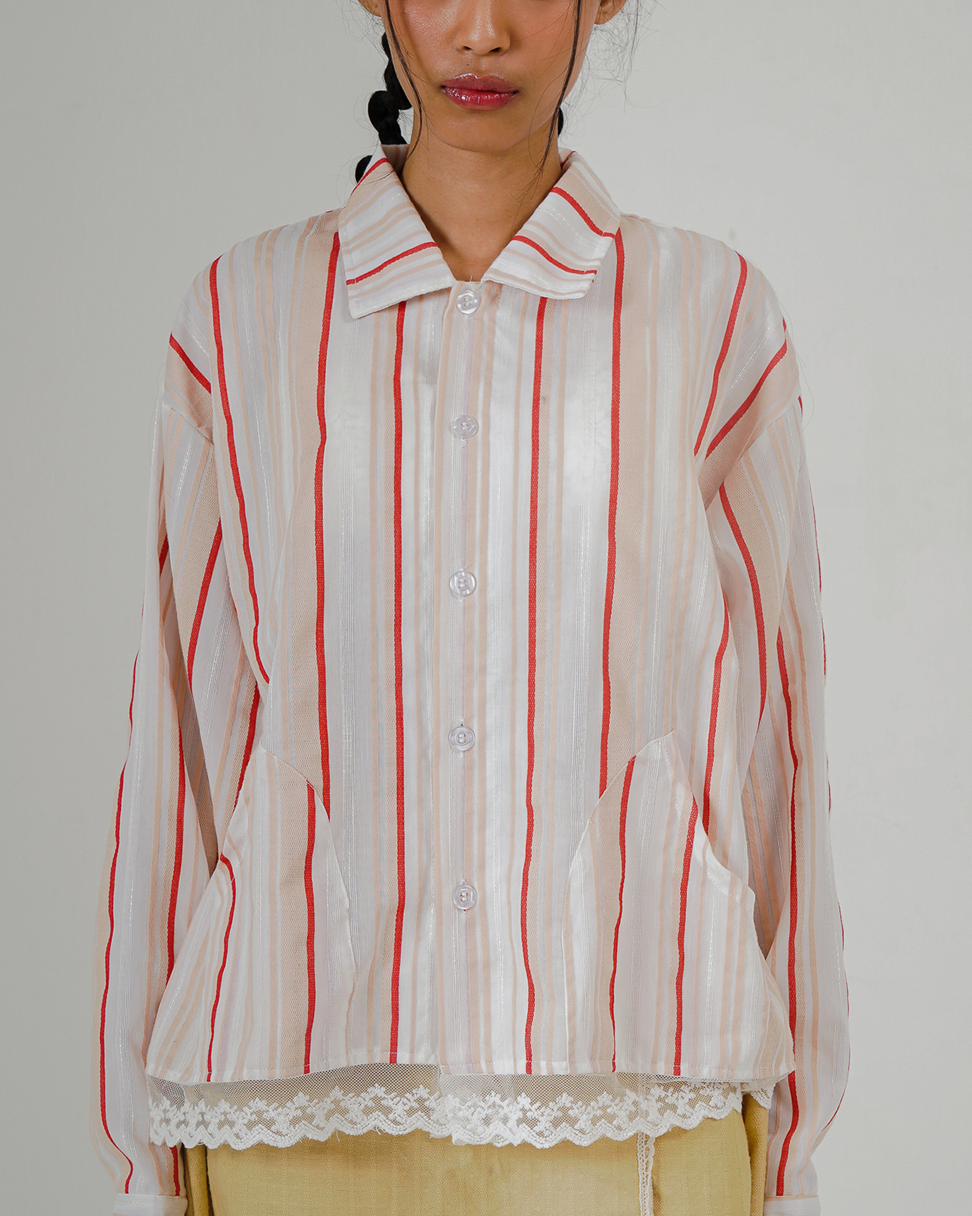 Image of Cempaka Stripes Jacket, a linen jacket with pockets and delicate lace details at the hem.