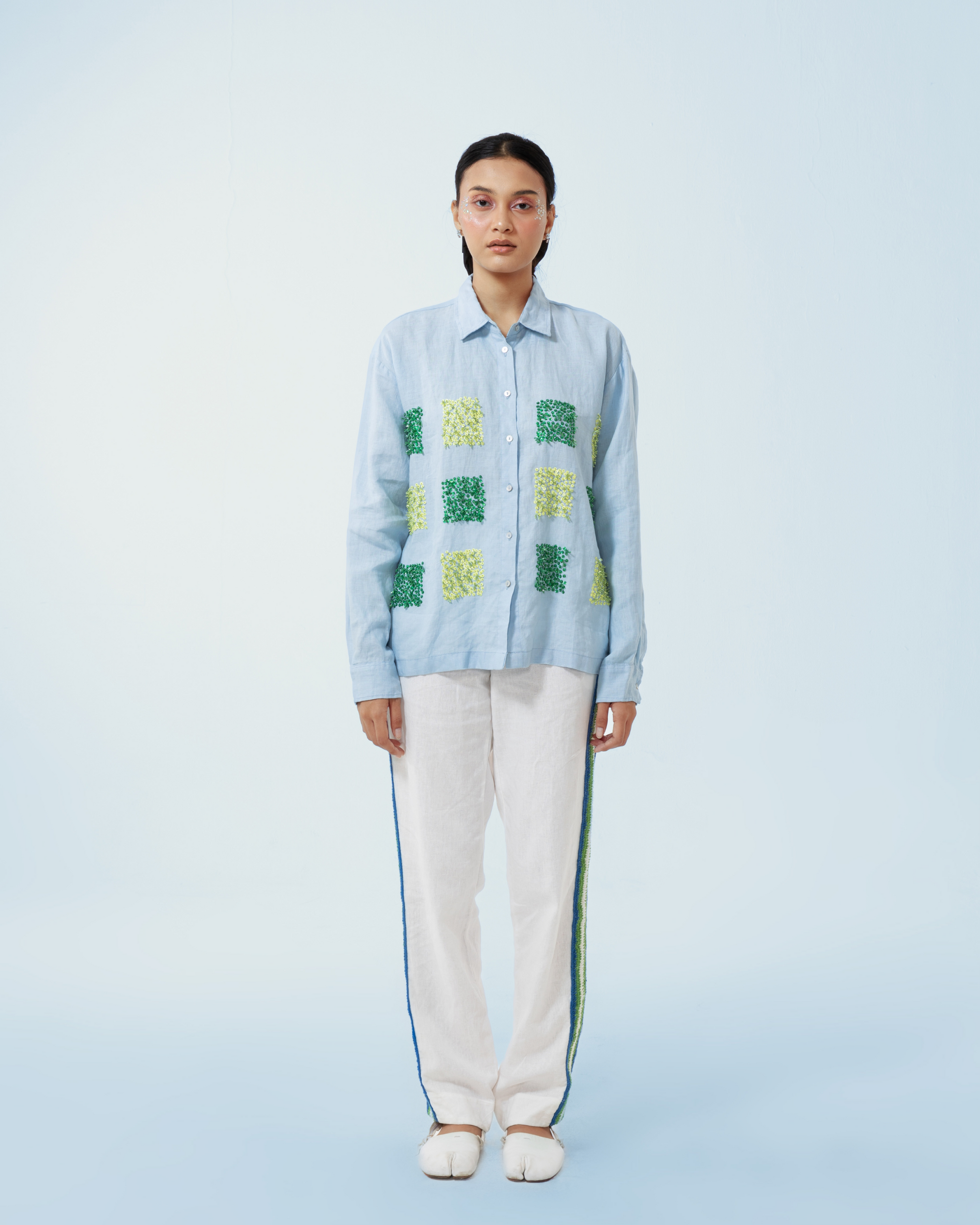 Image of Claude Longsleeve Shirt, a linen longsleeve shirt adorned with hand-sewn beads in contrasting colors.