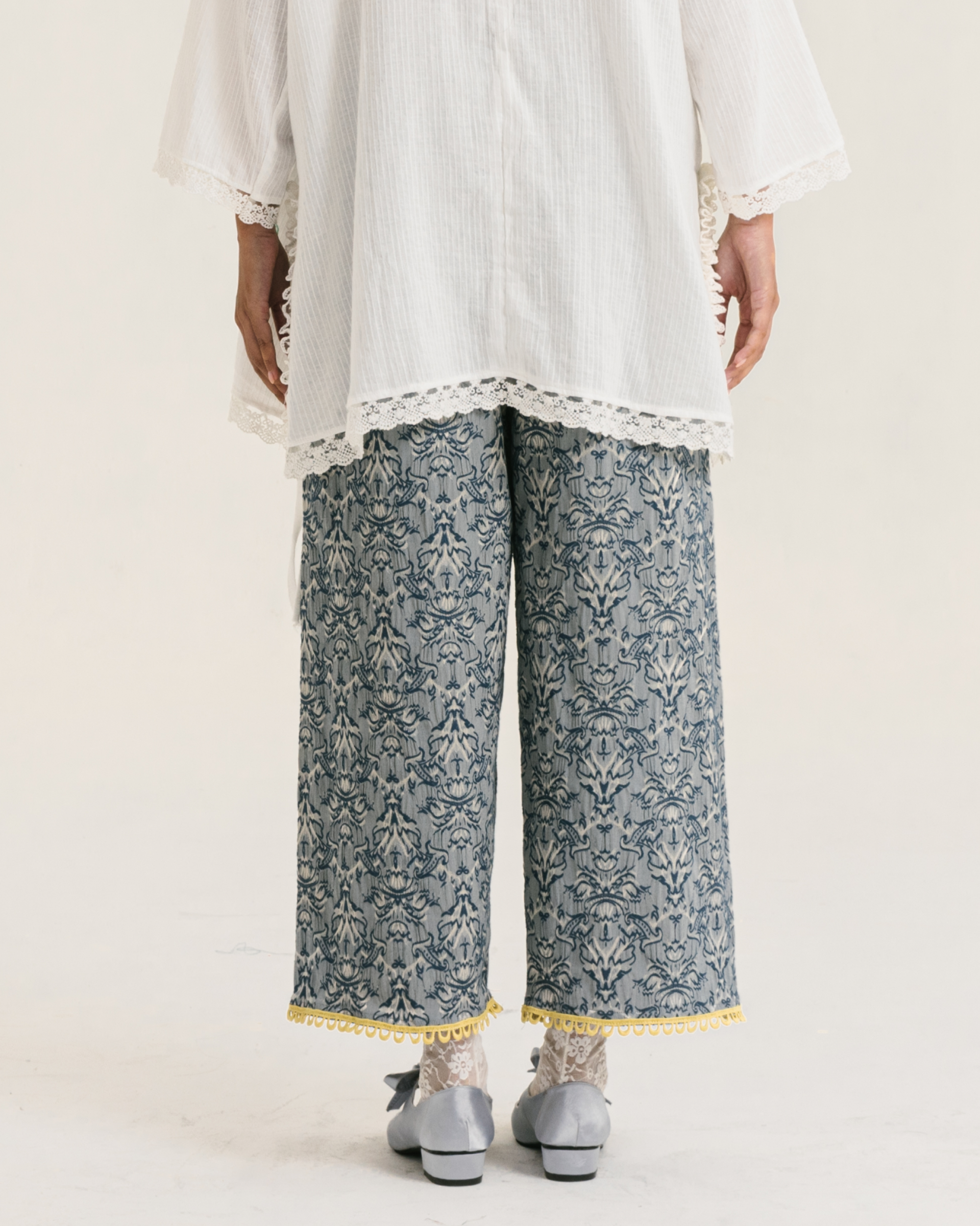 Image Cyra Pants Blue, a relaxed straight-cut pants made from vintage jacquard fabric.