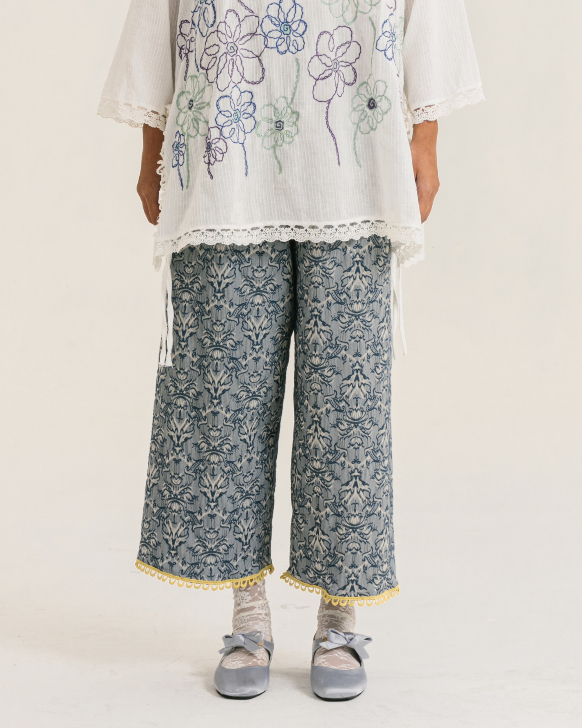 Image Cyra Pants Blue, a relaxed straight-cut pants made from vintage jacquard fabric.