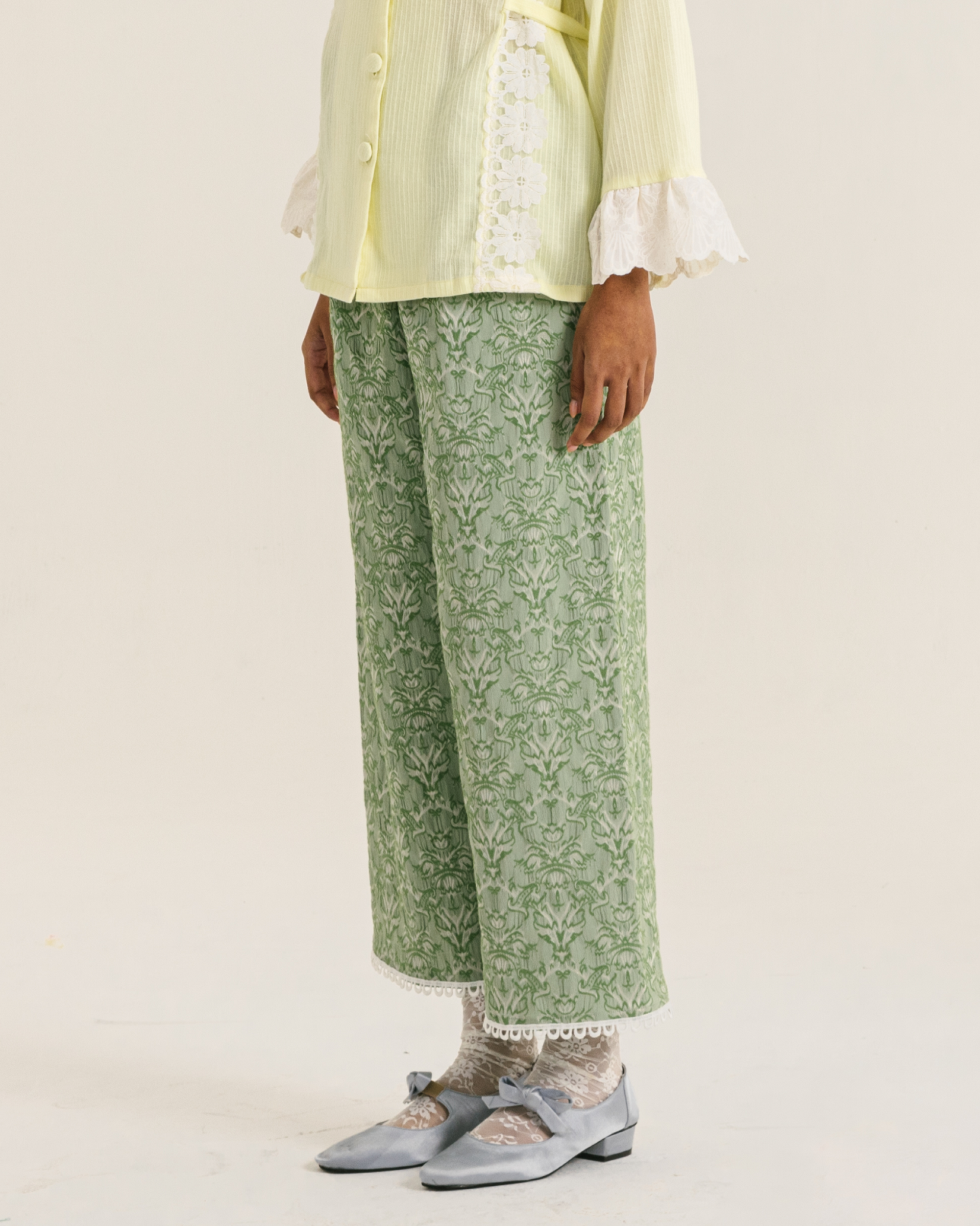 Image Cyra Pants Green, a relaxed straight-cut pants made from vintage jacquard fabric.