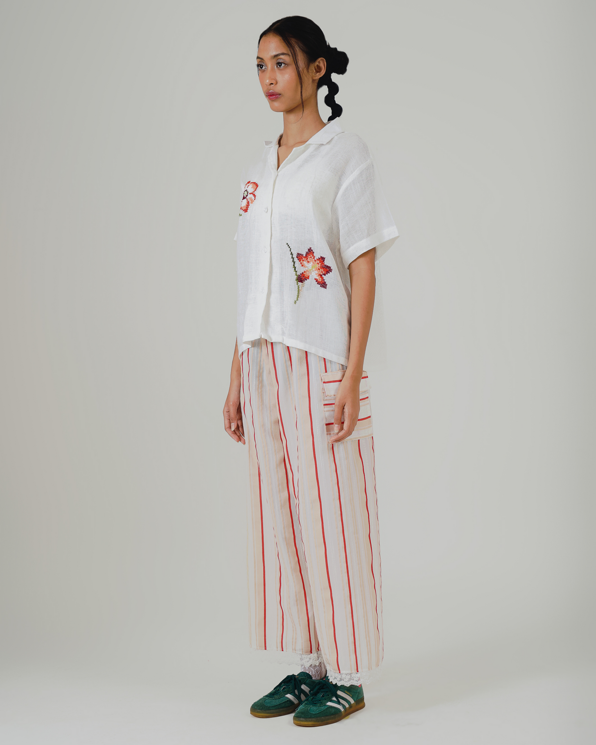 Image of Dhayu Cross Stitches Shirt, a linen shirt, hand-embroidered with flower-patterned cross-stitches.