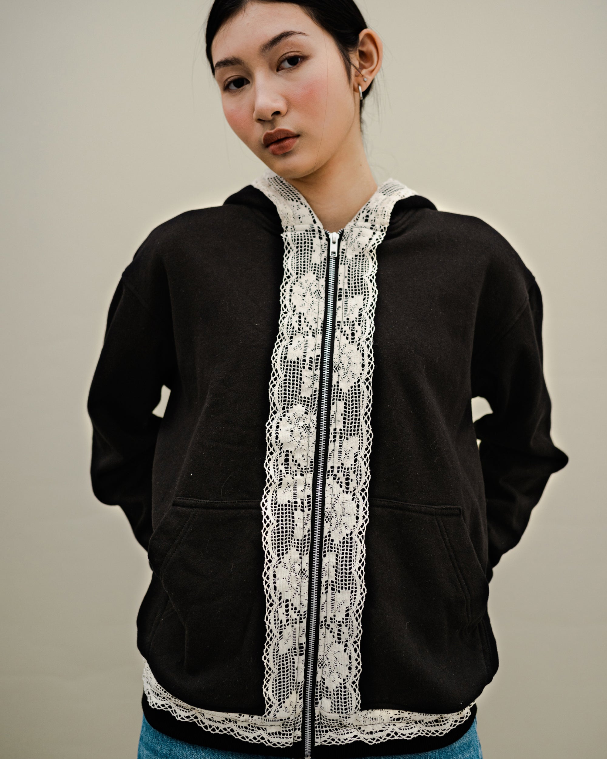 Image of Dune Lace Hoodie Black, a hoodie jacket with lace detail on along the zipper.