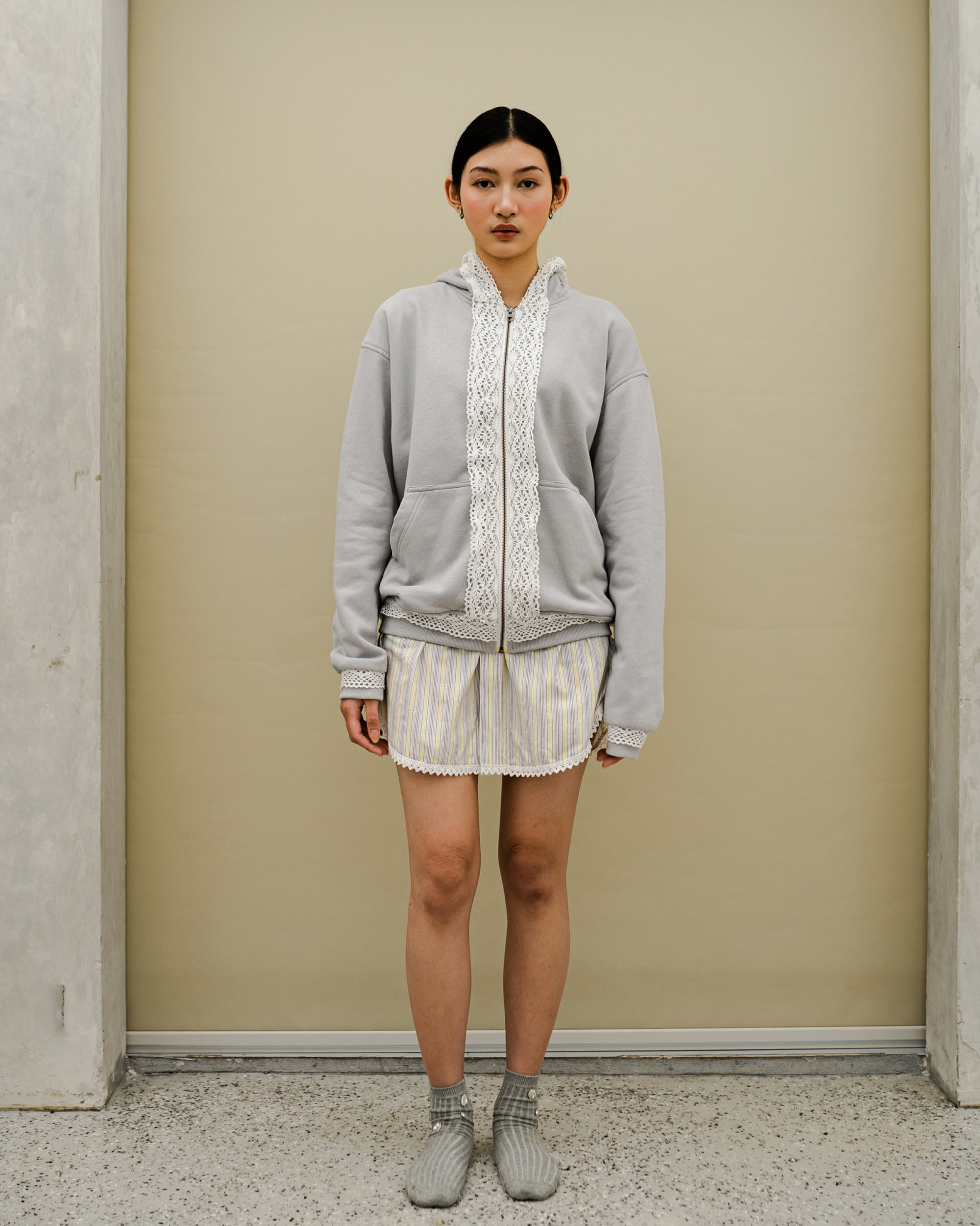 Image of Dune Lace Hoodie Grey, a hoodie jacket with lace detail on along the zipper.