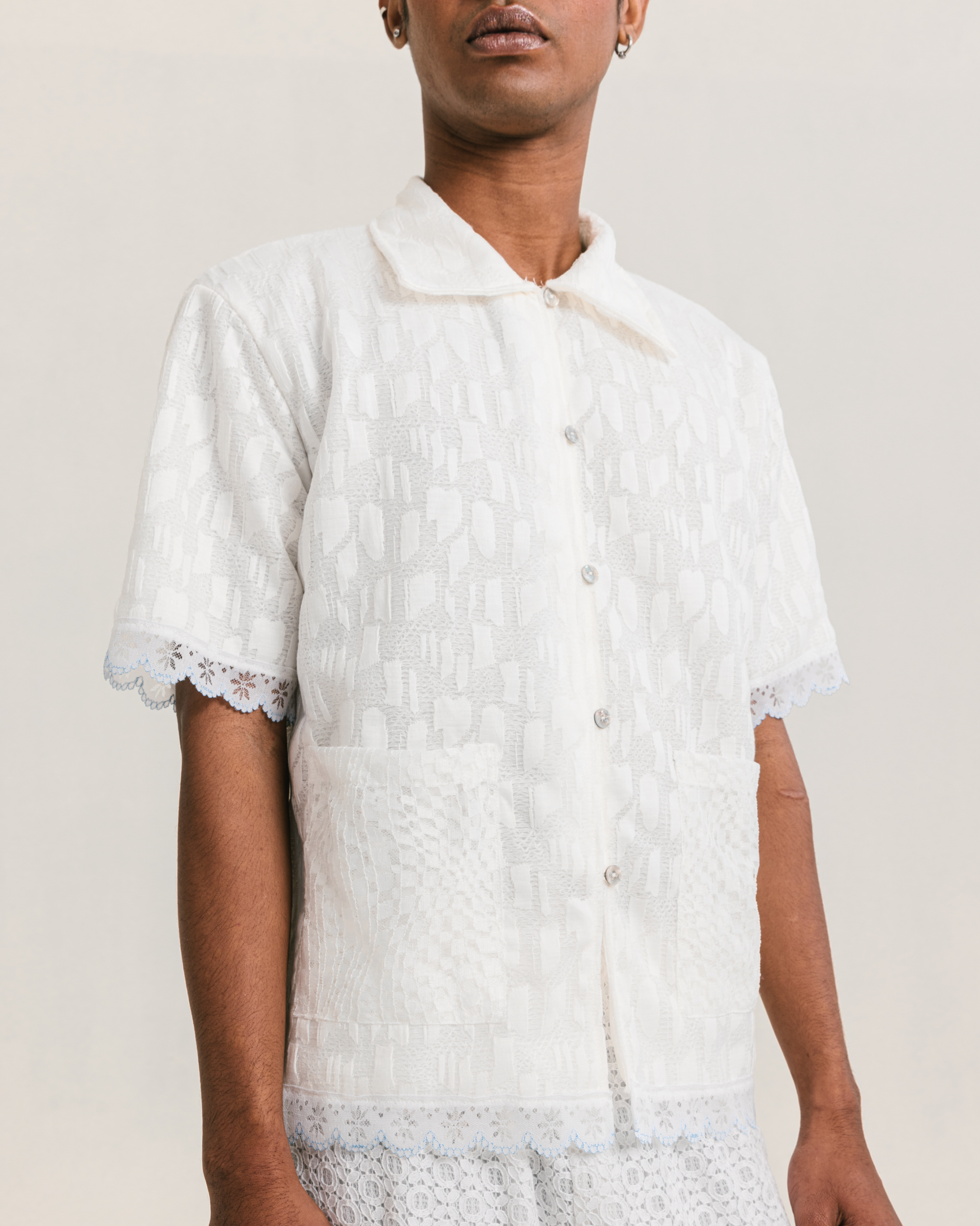 Image of Elmer Lace Shirt, a unisex shirt made from cotton with a delicate lace detailing that adds a touch of elegance.