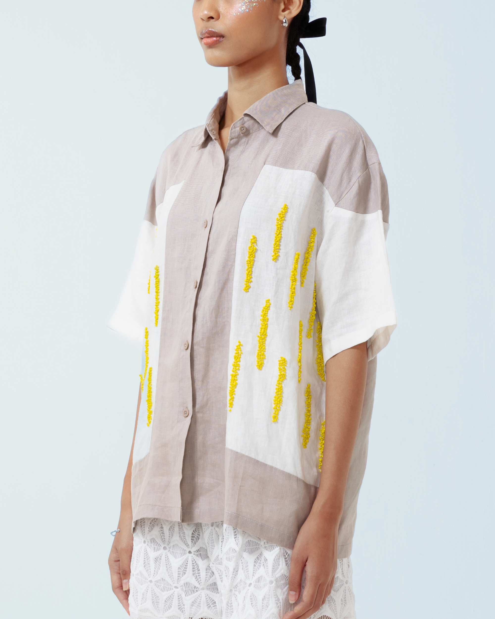 Image of Gloria Shirt, a linen shirt adorned with hand-sewn beads on the front.