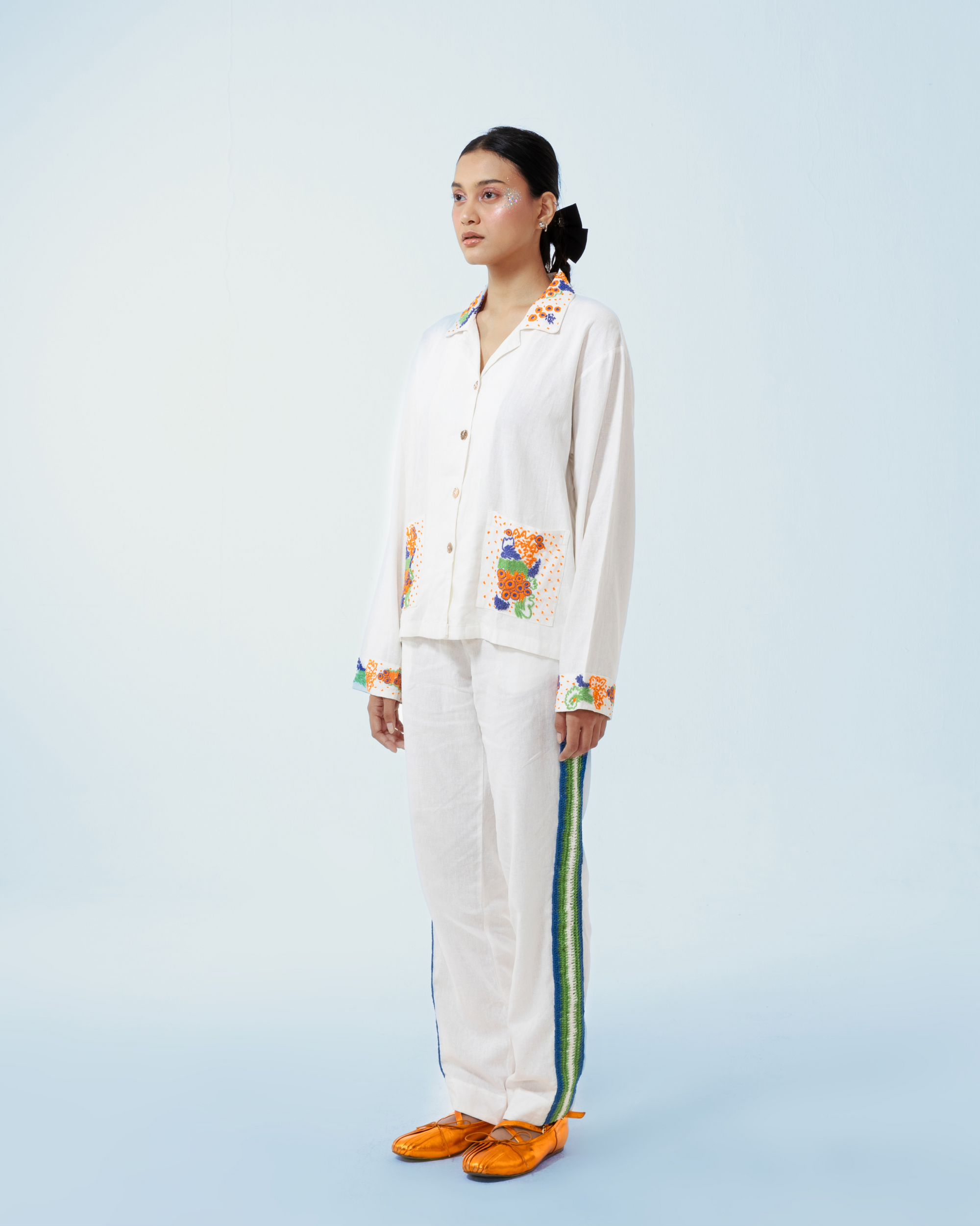 Image of Granada Jacket White, a shirt-jacket made from deadstock linen with a hand-embroidery detailing on the collar, pockets, and cuffs.