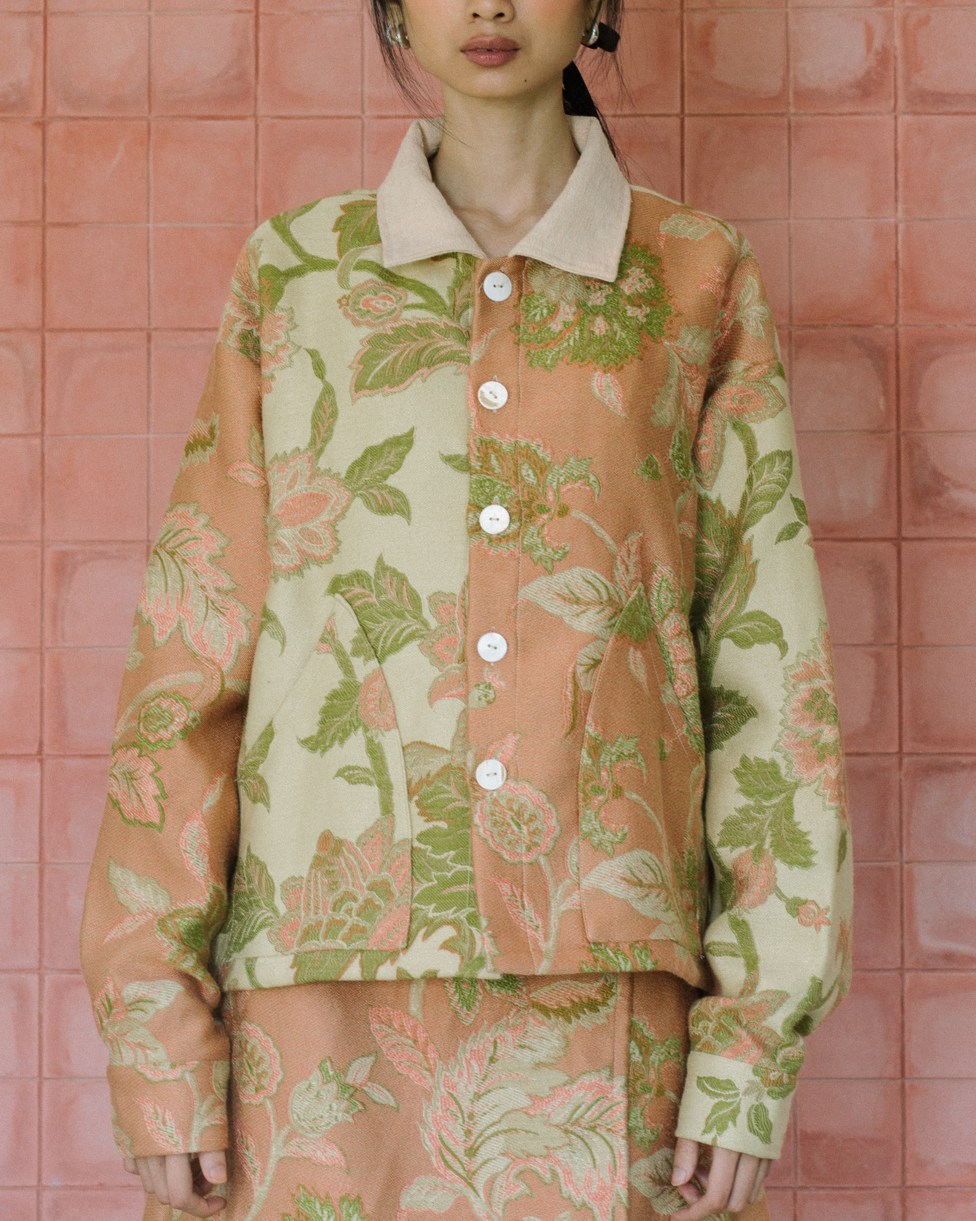 Image of Gretl Flower Jacket, a relaxed fit jacket made from jacquard fabric, adorned with unique white buttons. 