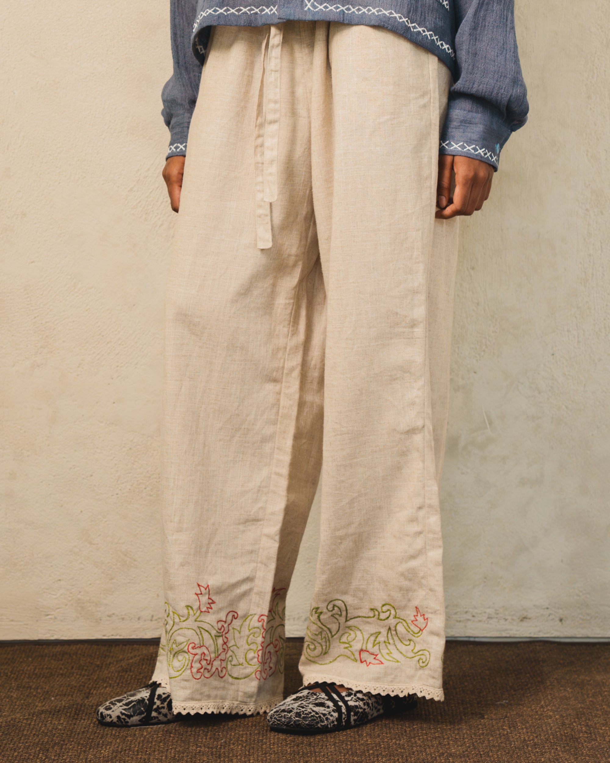 Image of Hansel Embroidery Pants Creme, wide-leg linen pants with adjustable drawstring waist.