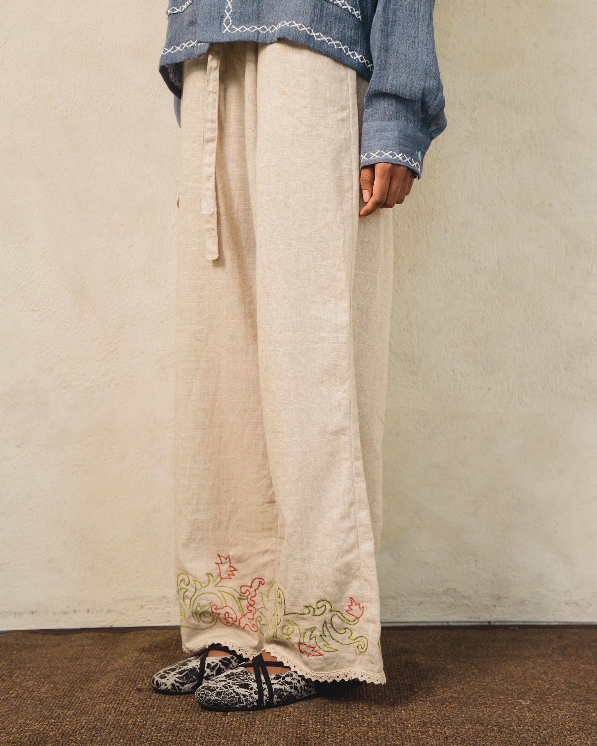 Image of Hansel Embroidery Pants Creme, wide-leg linen pants with adjustable drawstring waist.