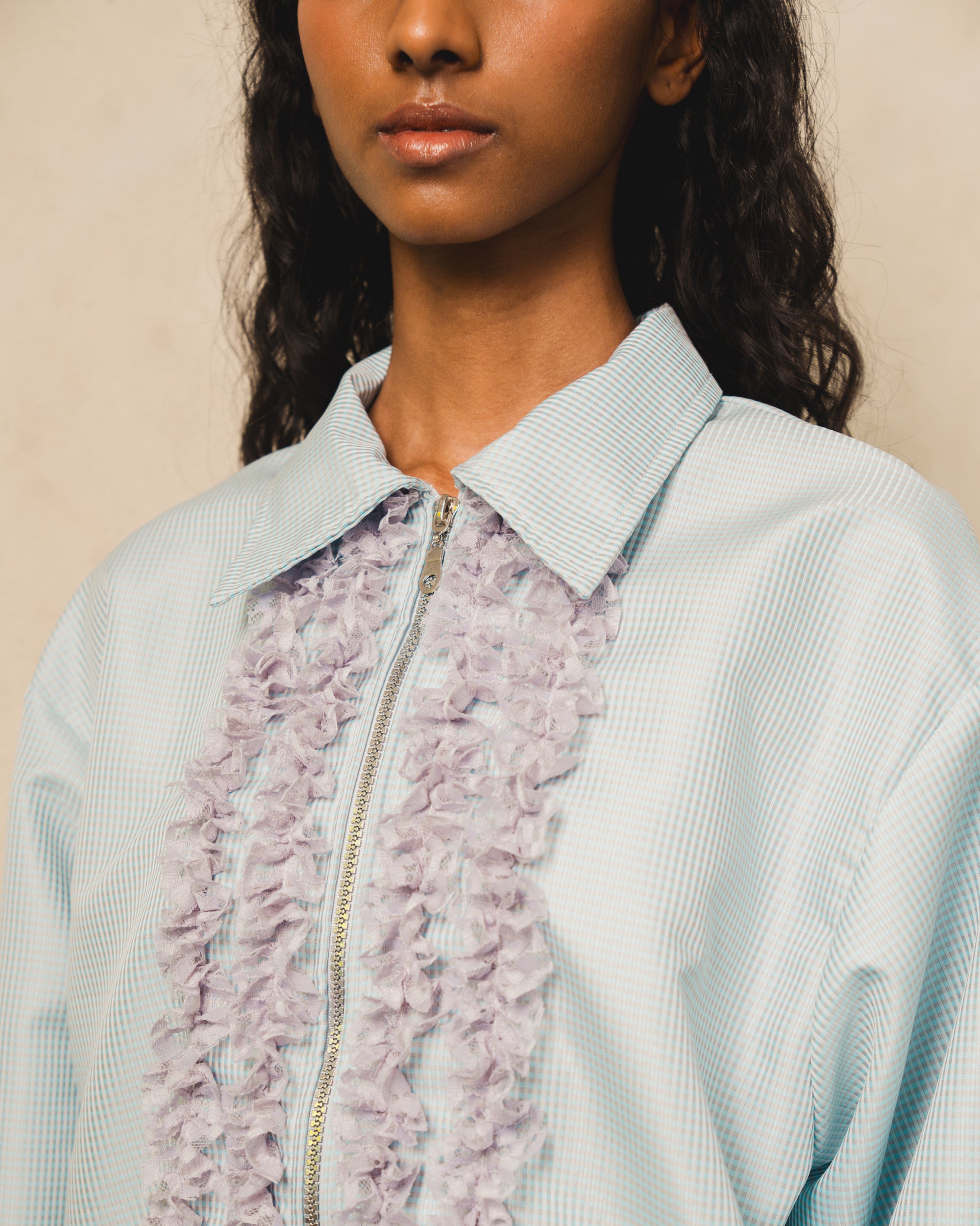 Image of Leila Ruffle Jacket Blue, a zip-up jacket made from semi-parachute cotton, finished with ruffles on the front.