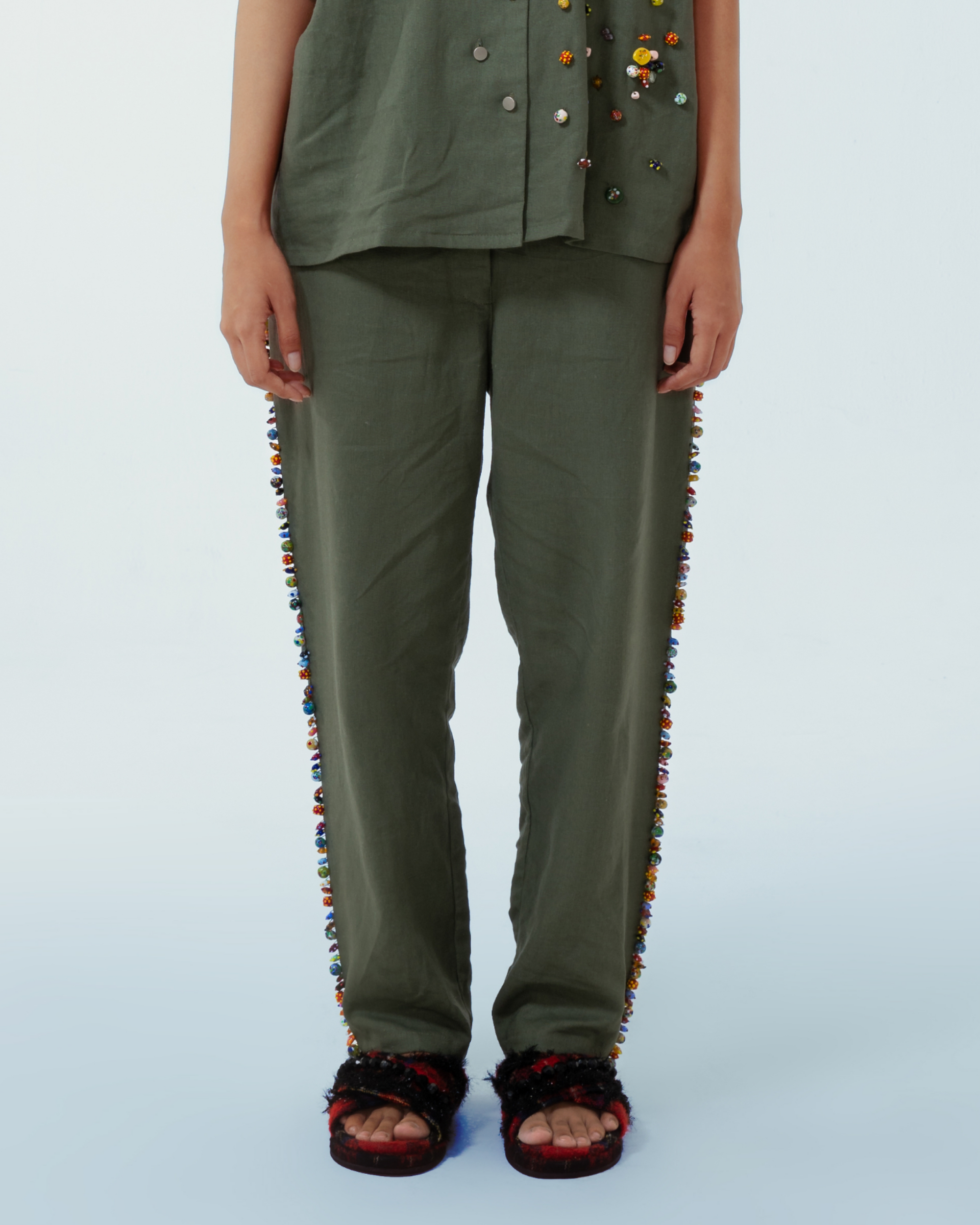 Image of Lola Pants Green, a pants made from deadstock linen with hand-sewn recycled beads on the side of the pants.