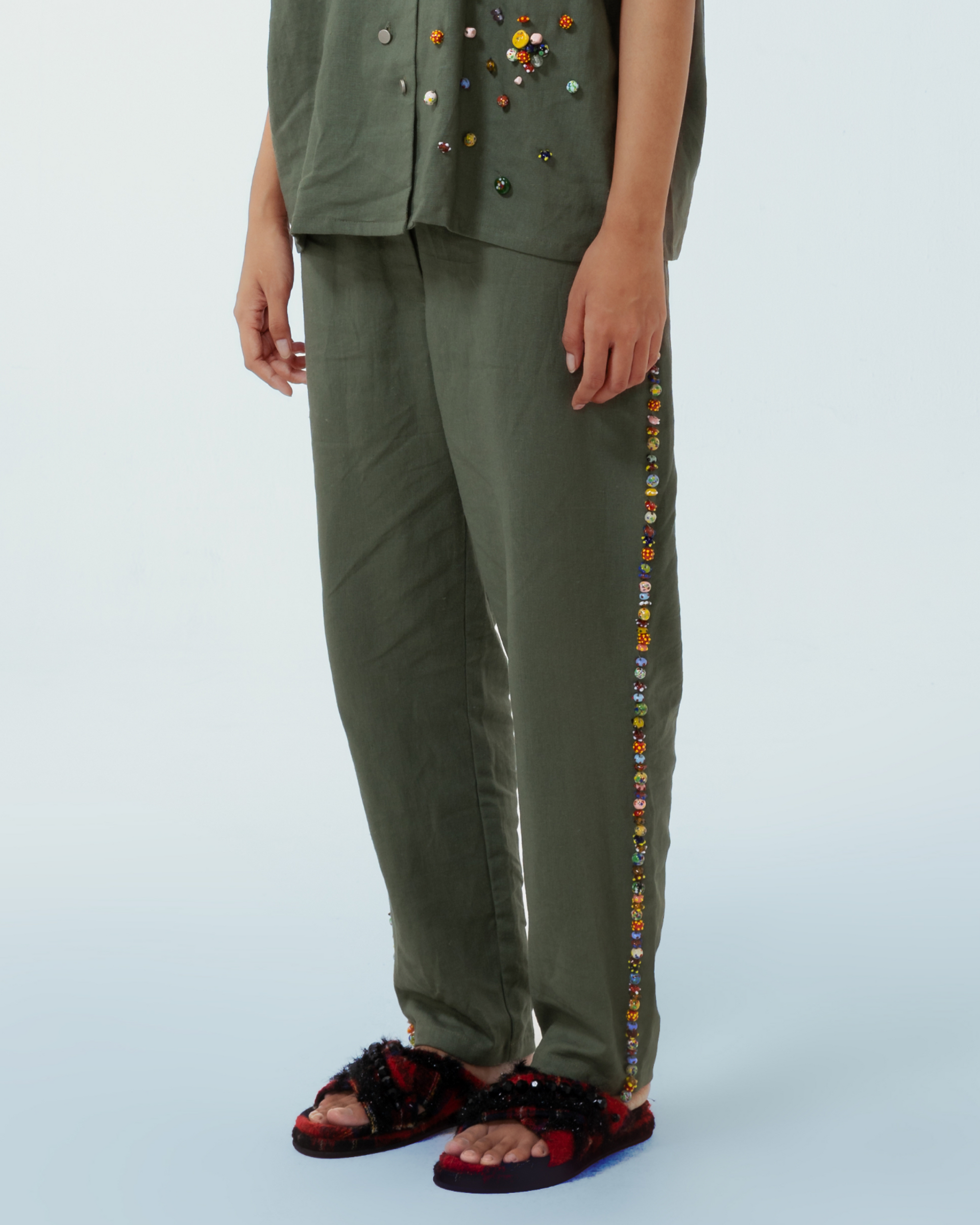 Image of Lola Pants Green, a pants made from deadstock linen with hand-sewn recycled beads on the side of the pants.