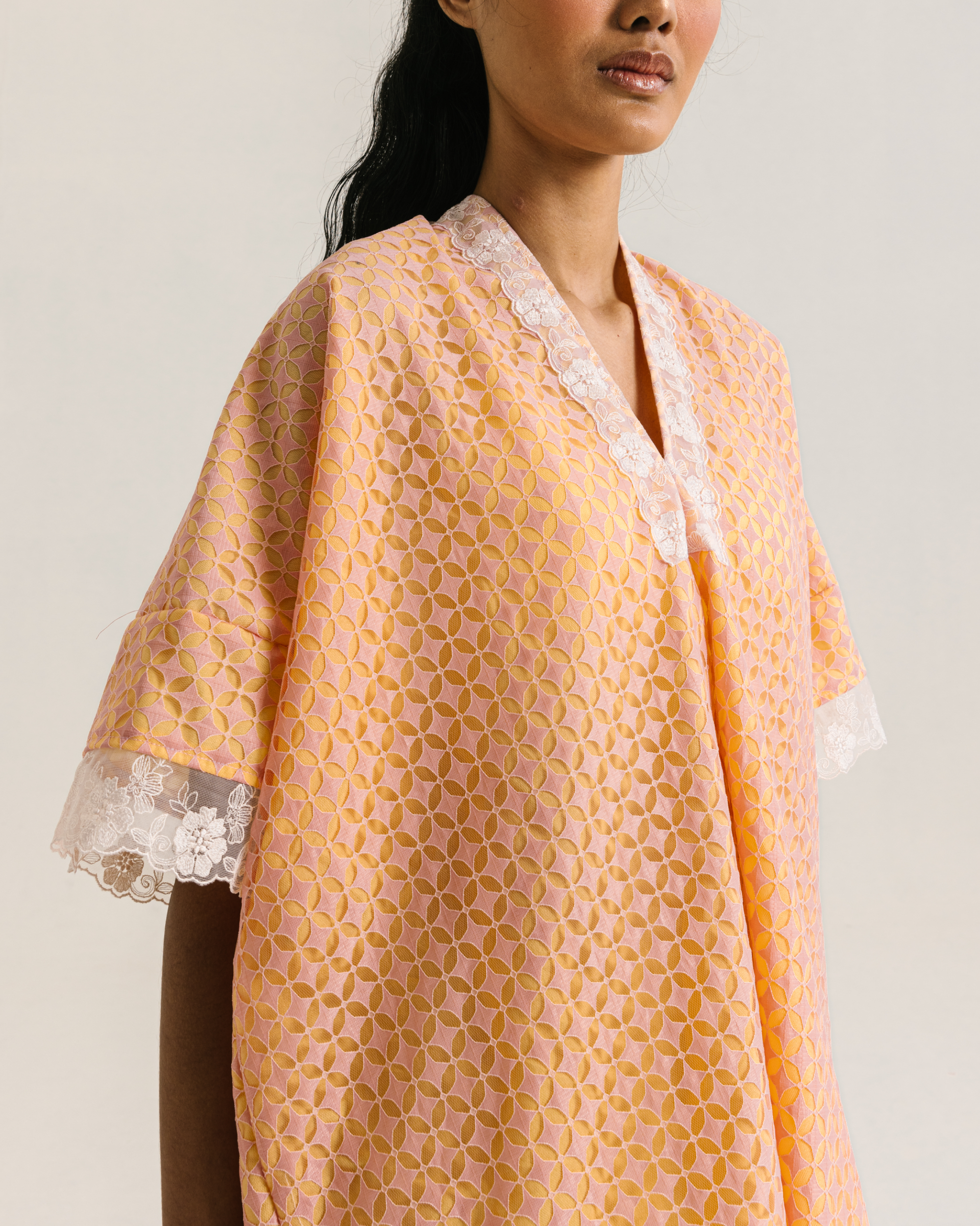 Image of Lucy Blouse Orange, a relaxed-fit blouse made from brocade and cotton with a modest v-neckline.