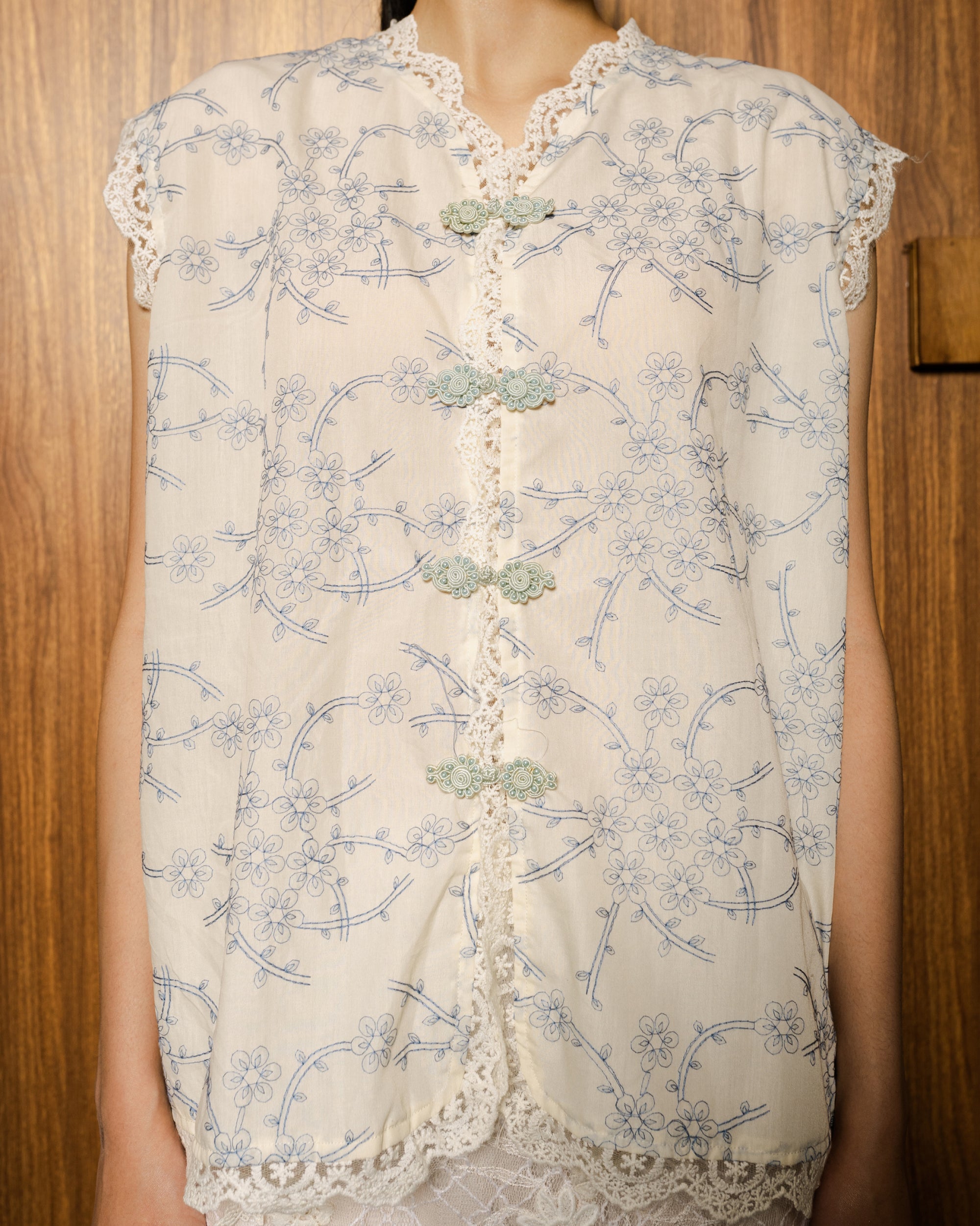 Image of Lunar Embroidery Vest Blue, a sleeveless top made from embroidered cotton.