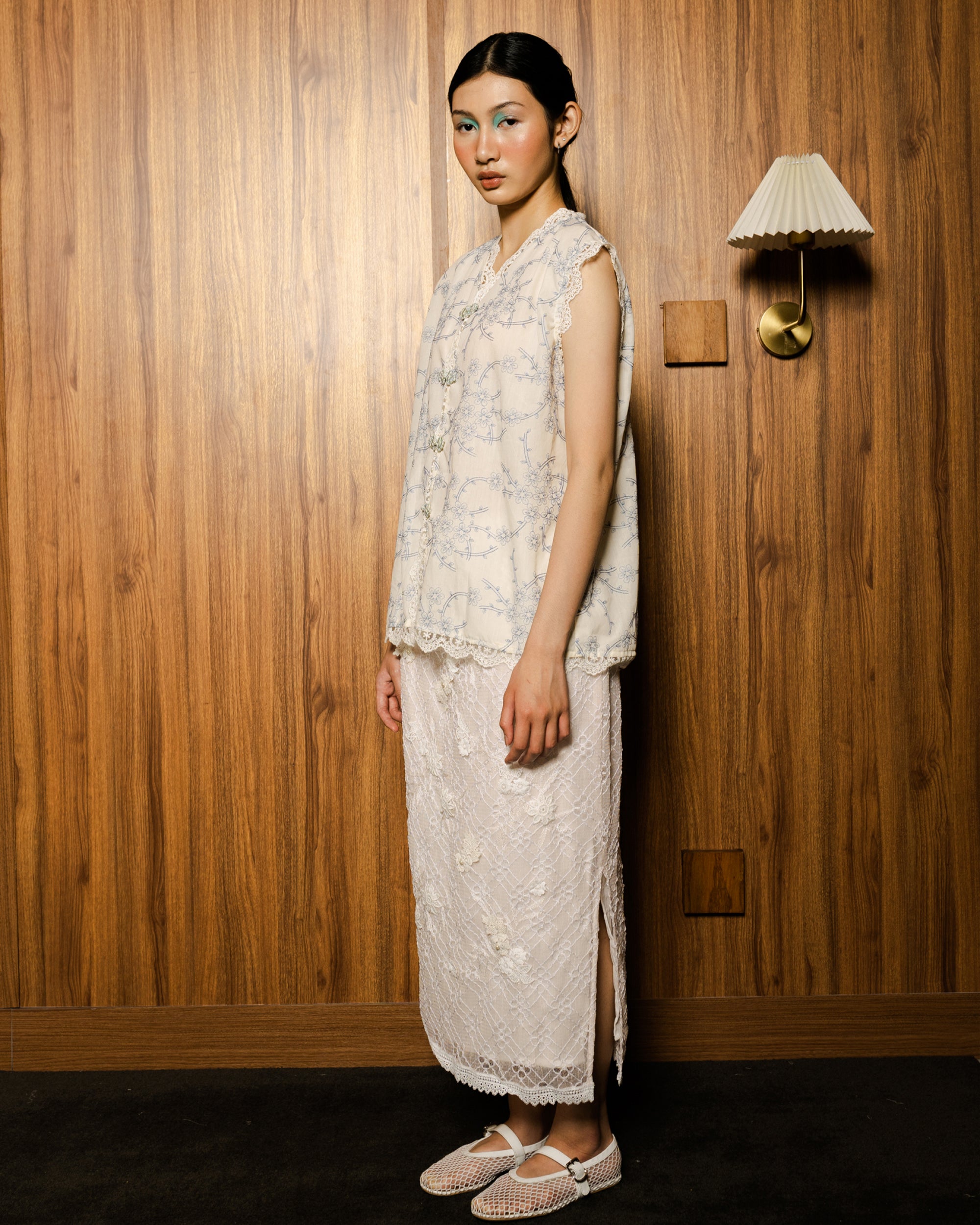 Image of Lunar Embroidery Vest Blue, a sleeveless top made from embroidered cotton.