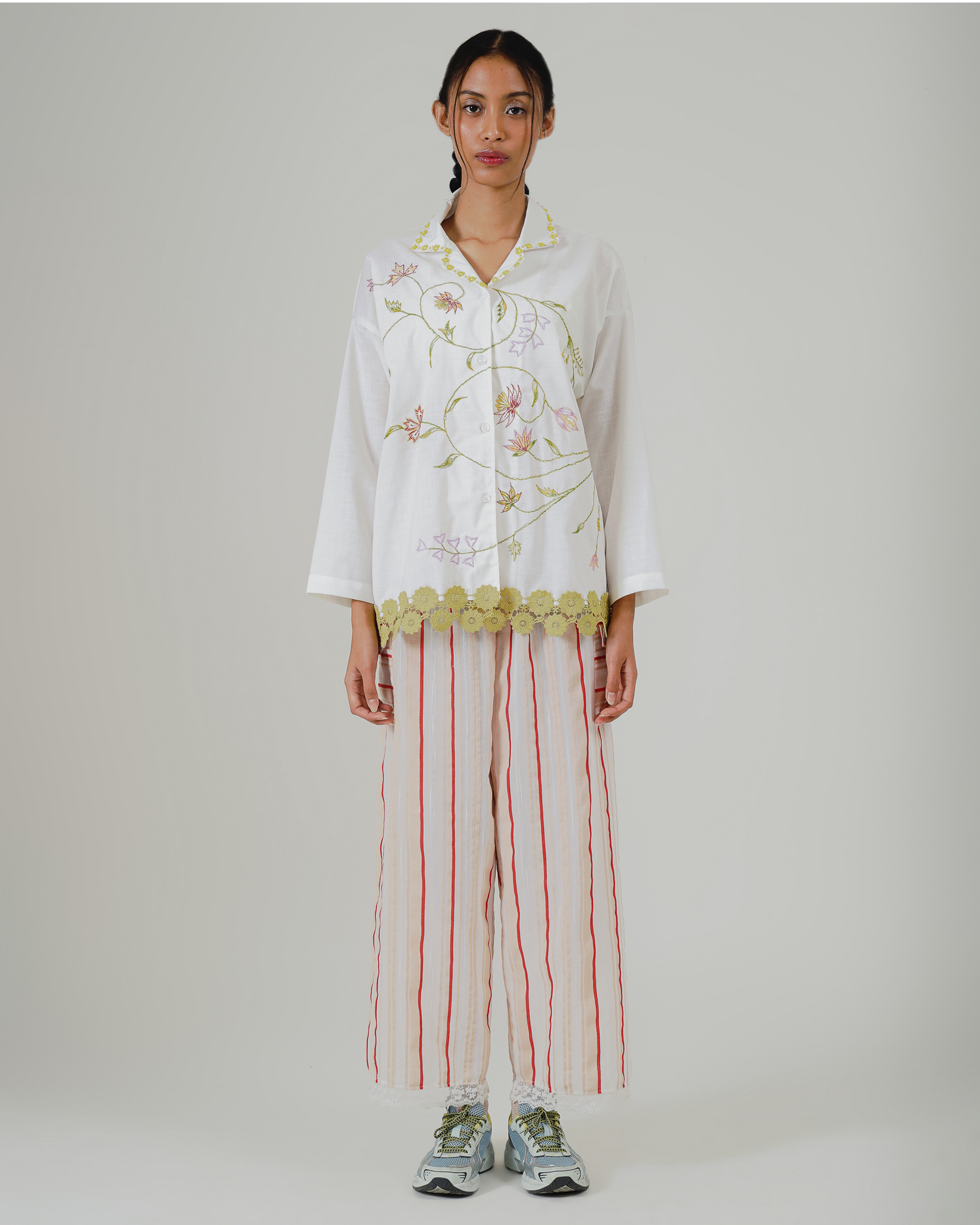 Image of Maira Embroidery Shirt Jacket, a long-sleeve top, adorned with flower embroidery and lace detailing at the hem.