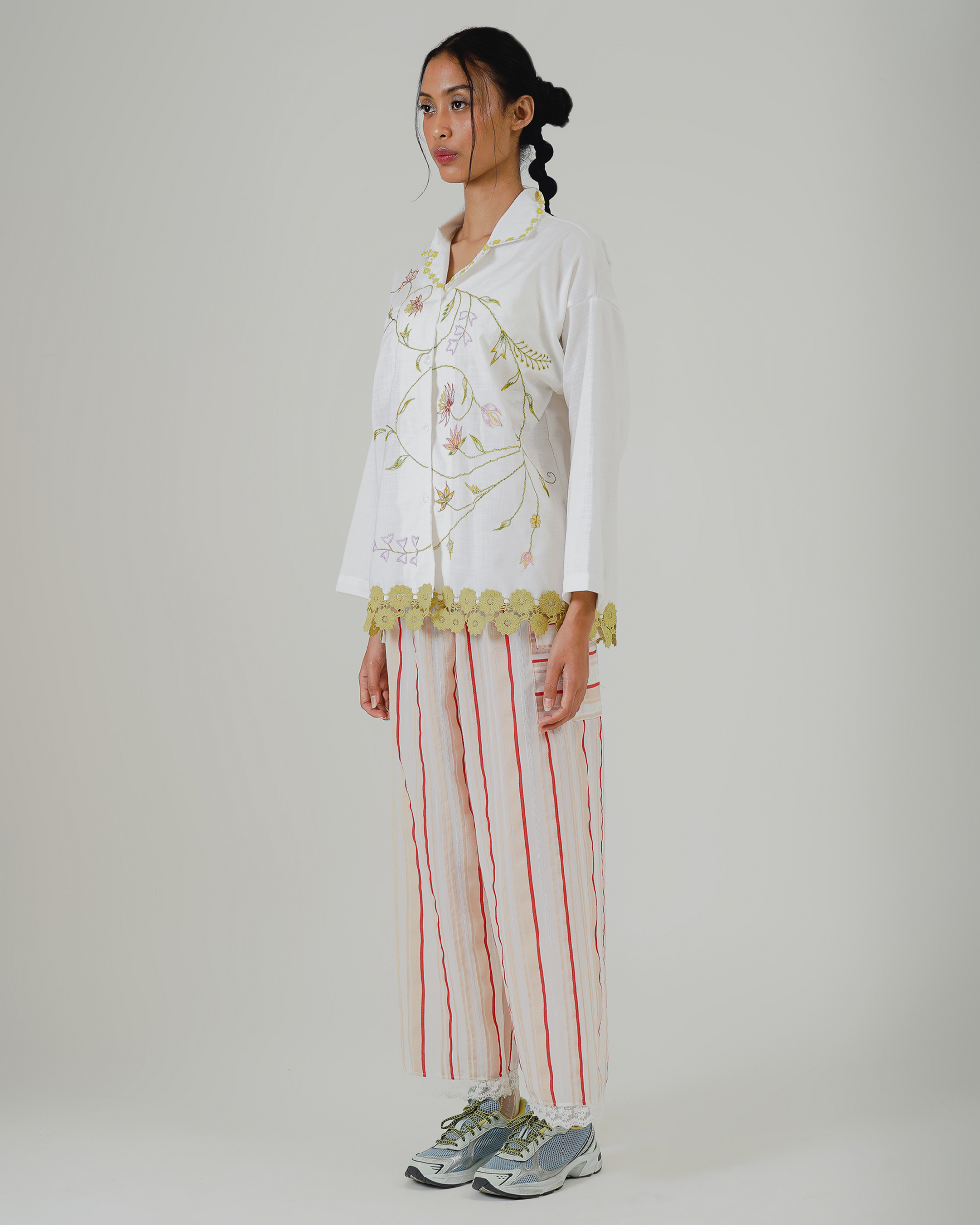 Image of Maira Embroidery Shirt Jacket, a long-sleeve top, adorned with flower embroidery and lace detailing at the hem.