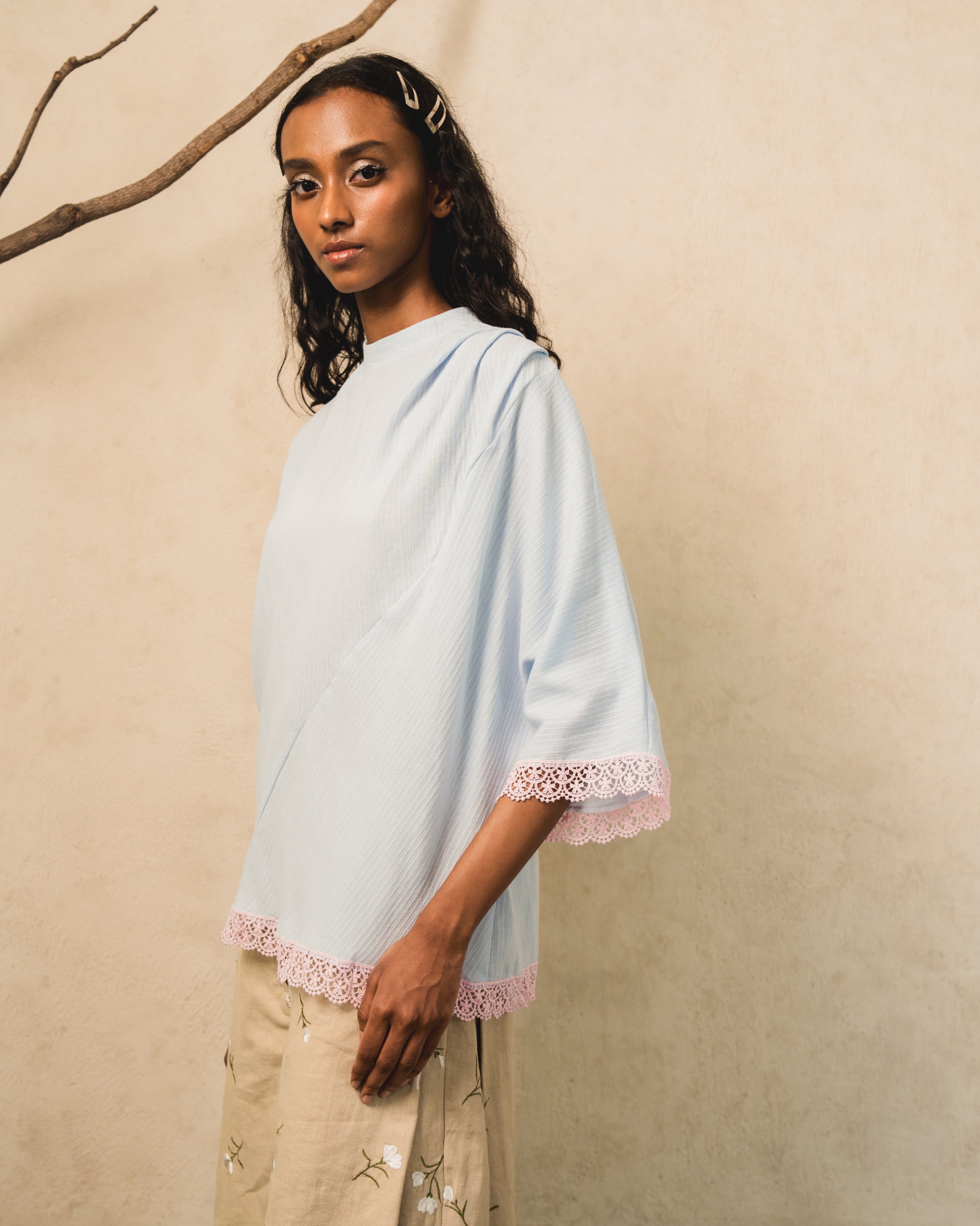 Image of Pierre Blouse Blue, an asymmetric drape blouse made from cotton-poly.