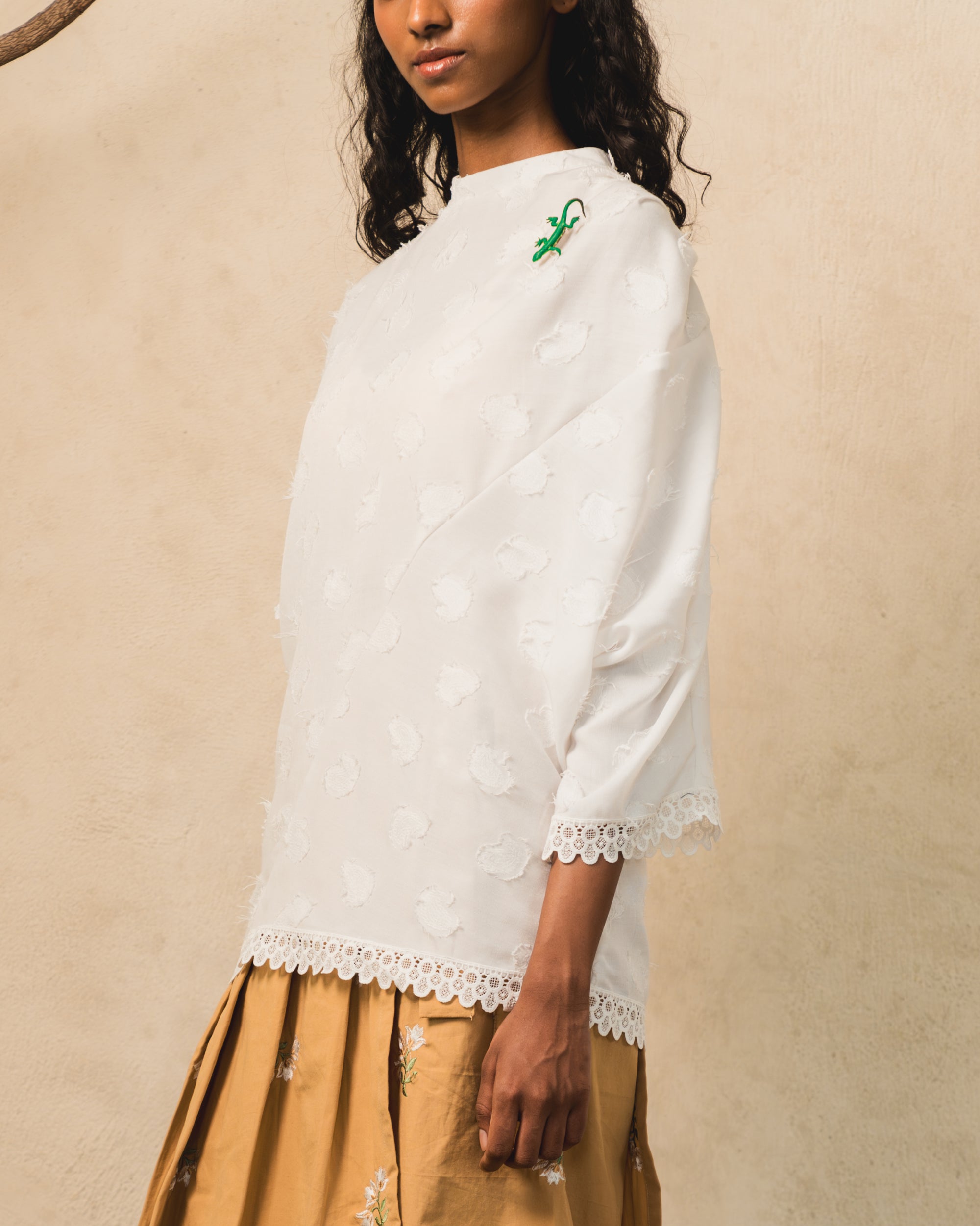 Image of Pierre Blouse White, an asymmetric drape blouse made from cotton.