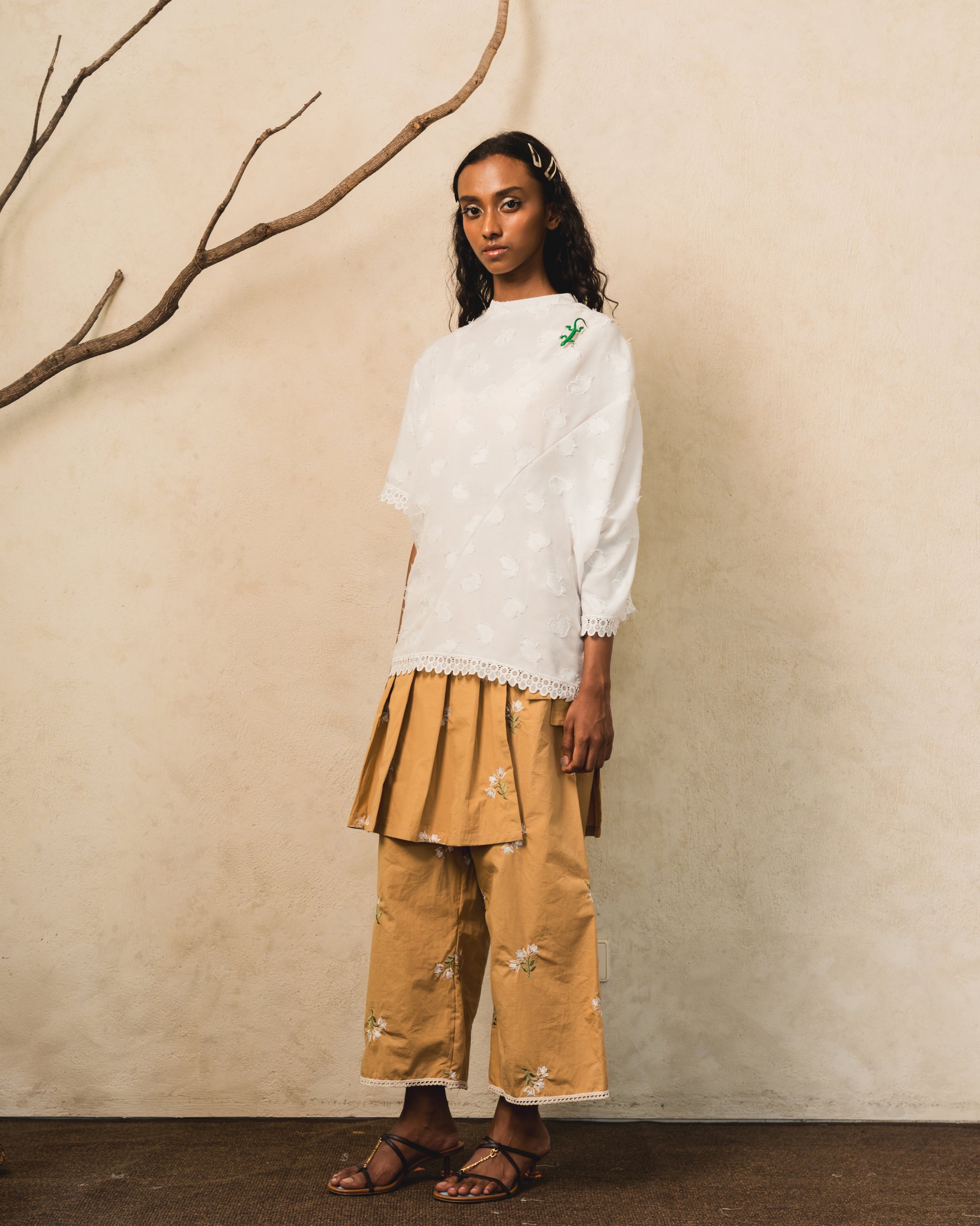 Image of Pierre Blouse White, an asymmetric drape blouse made from cotton.