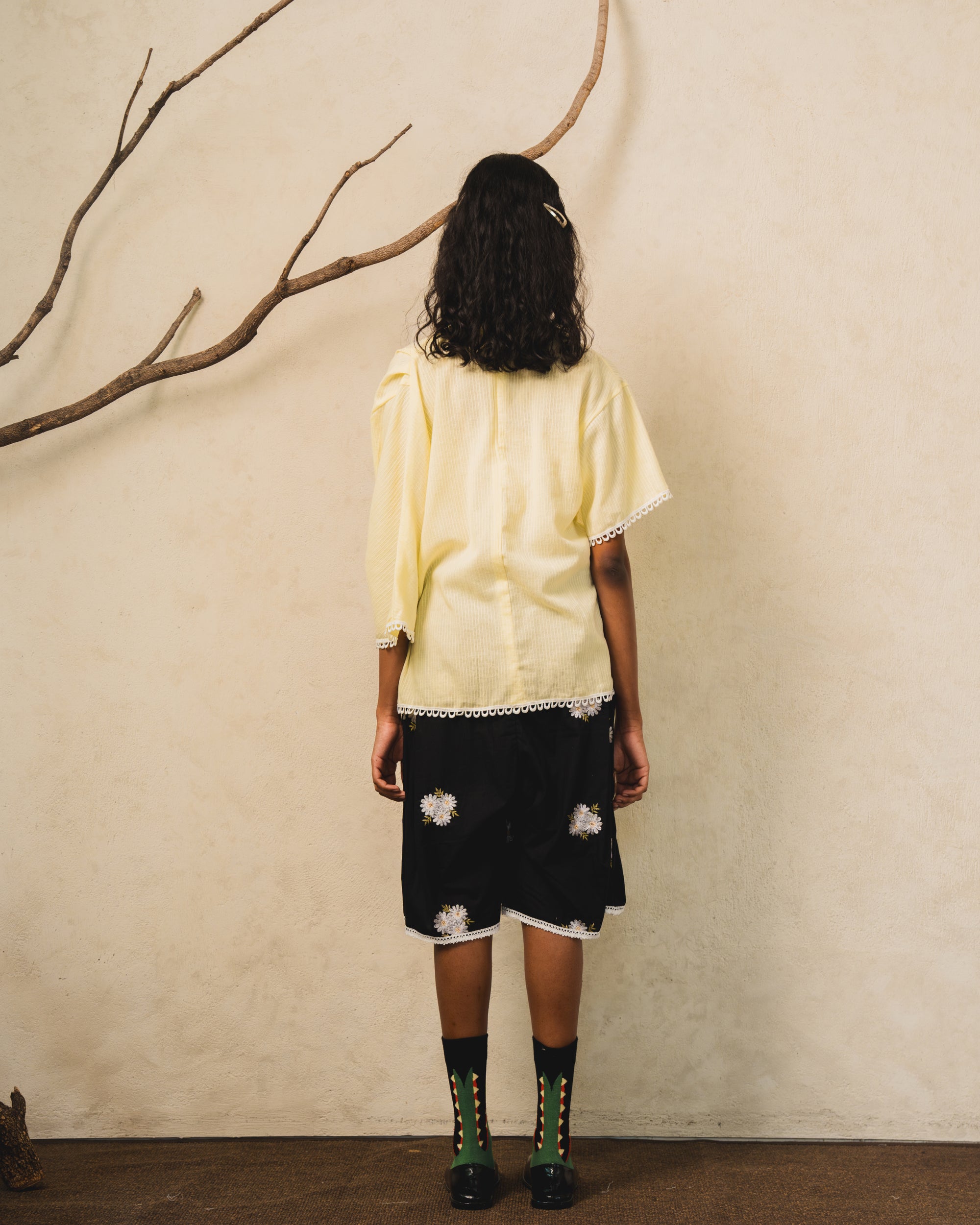 Image of Pierre Blouse Yellow, an asymmetric drape blouse made from cotton-poly.