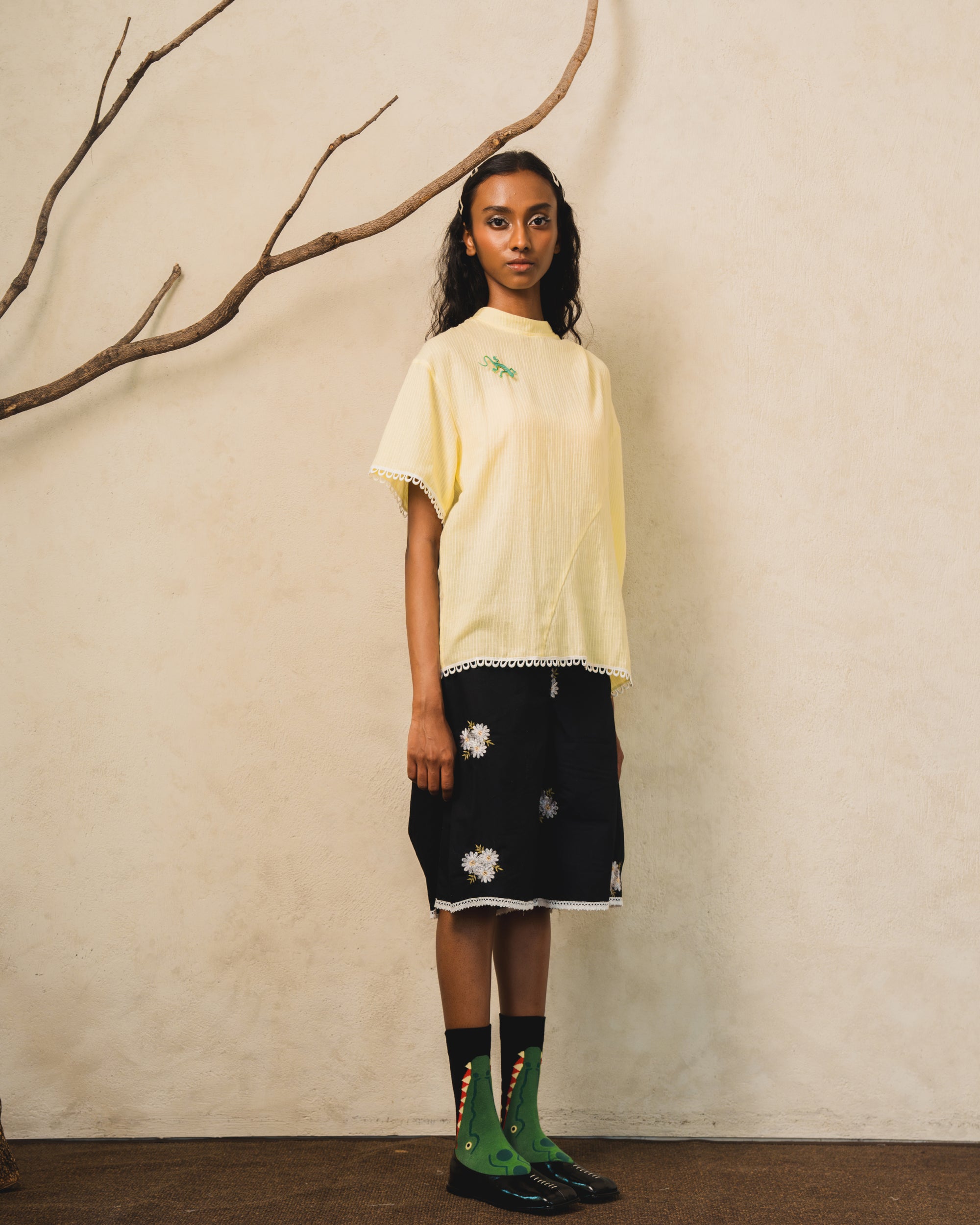 Image of Pierre Blouse Yellow, an asymmetric drape blouse made from cotton-poly.