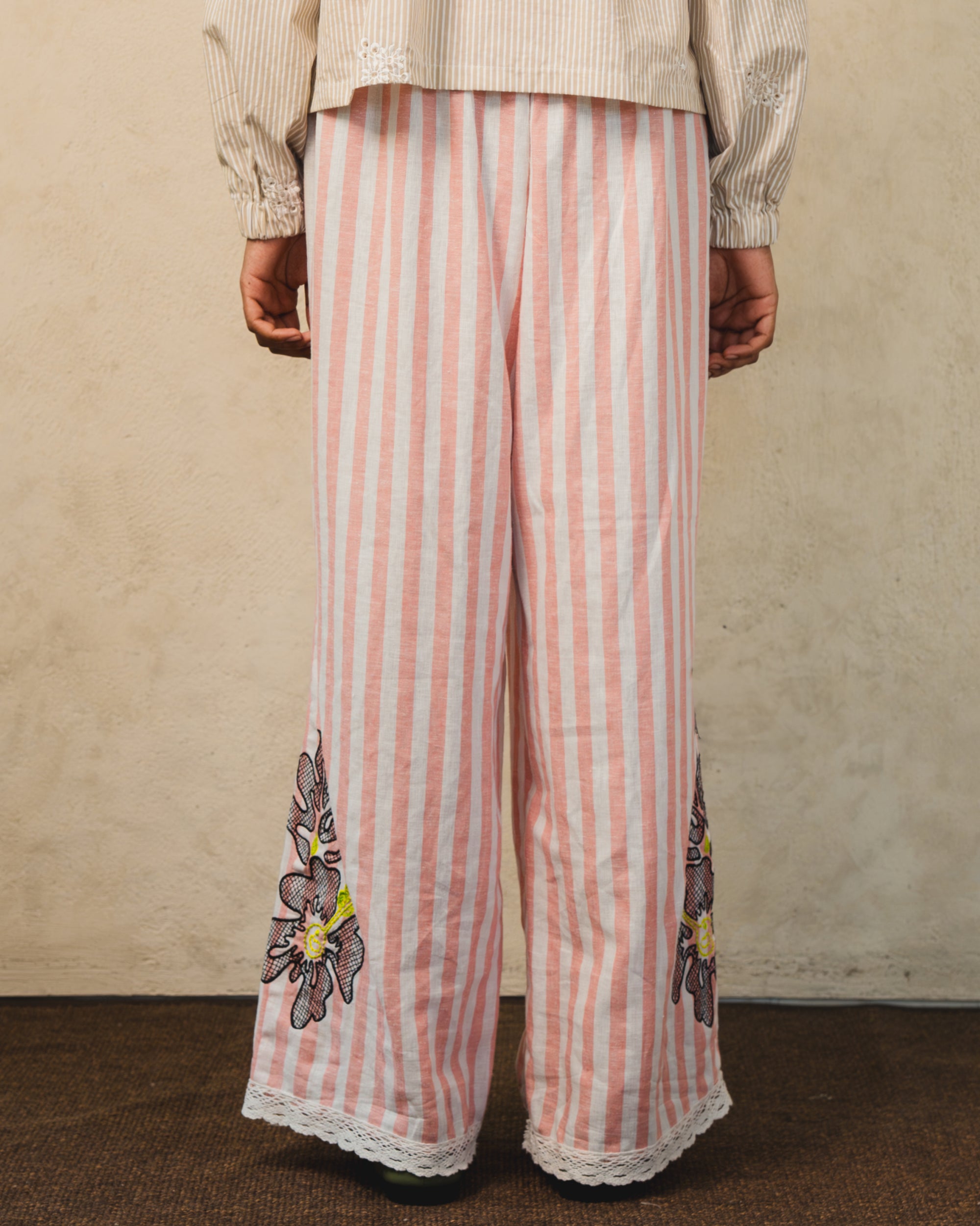 Image of Pino Embroidery Pants Stripes, wide-leg linen pants with adjustable drawstring waist.